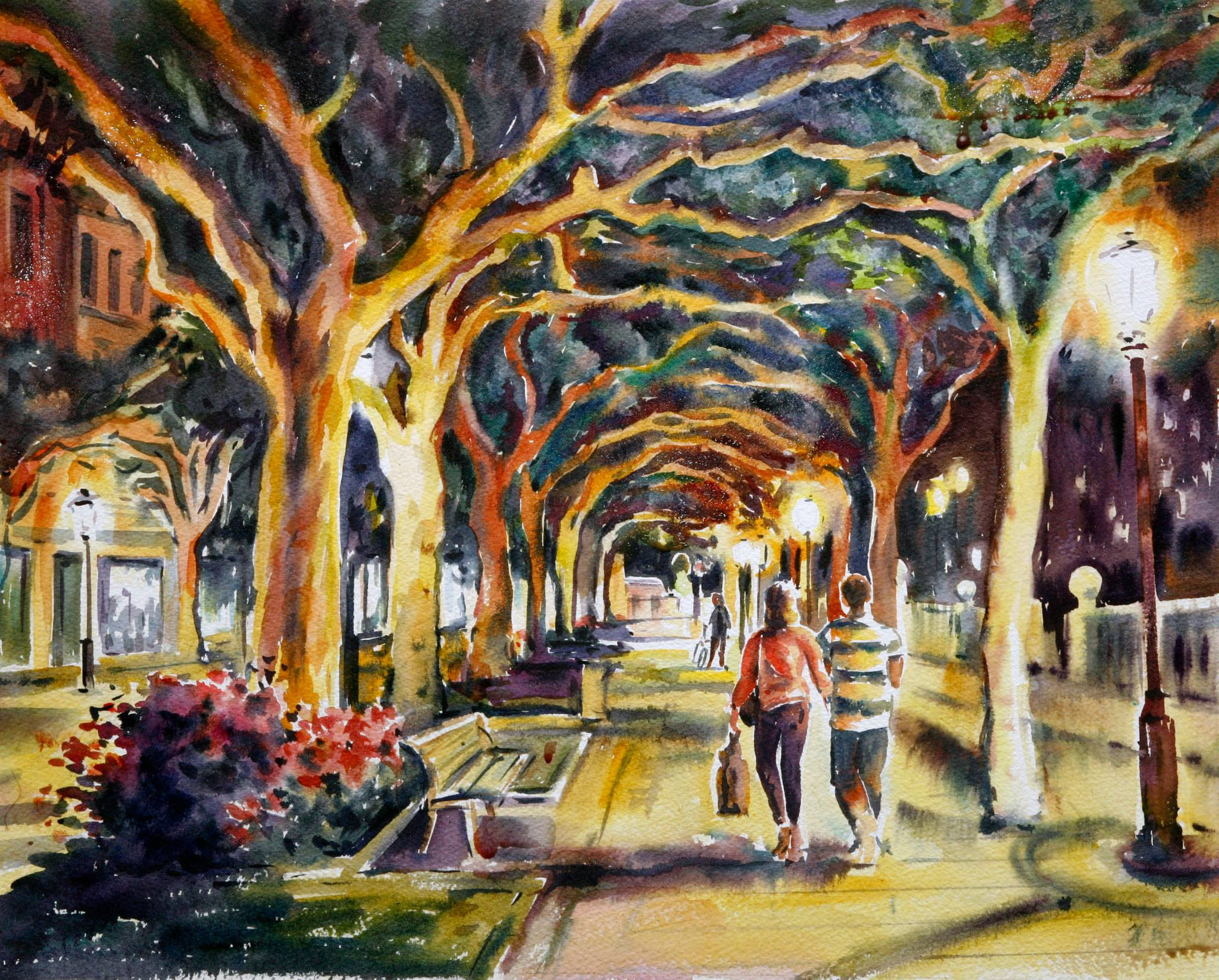 Пара прогуливается под кронами деревьев на бульваре Espolón