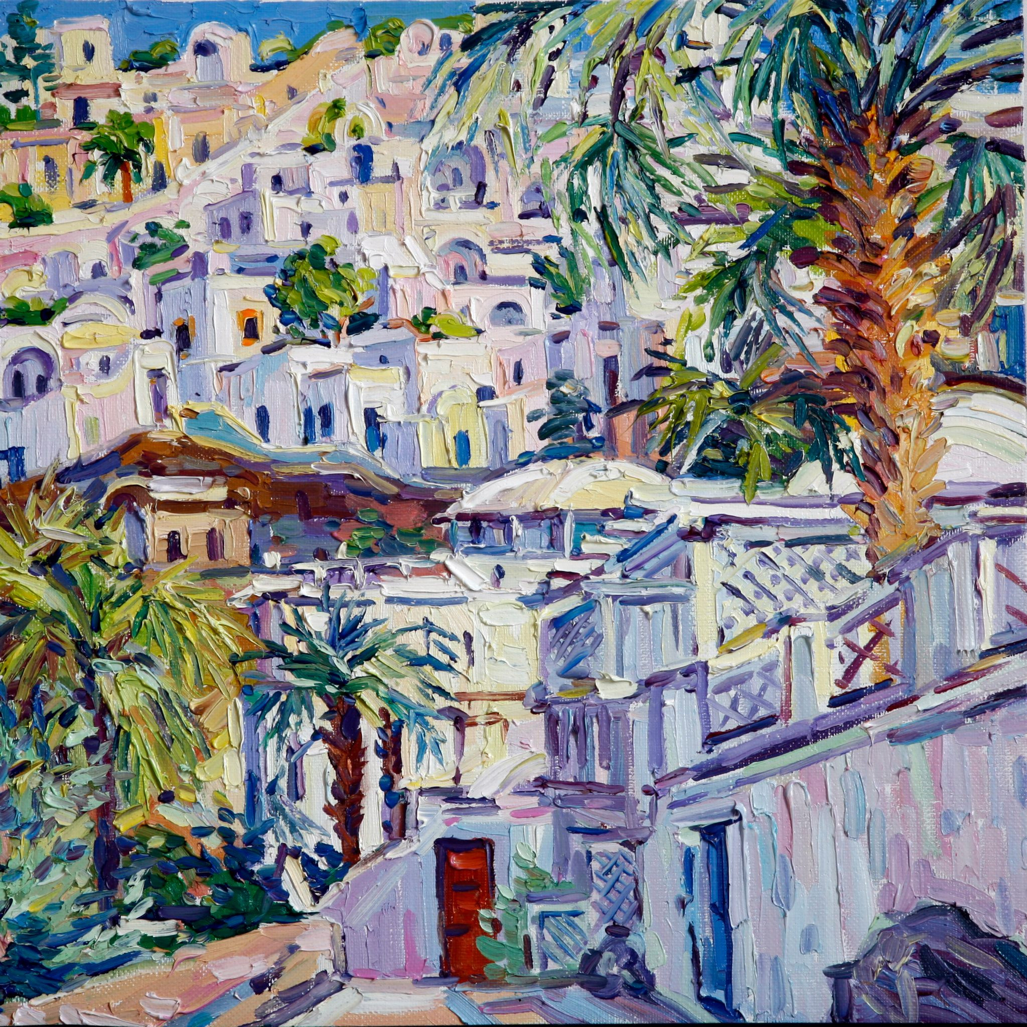 A slope with houses and a palm tree