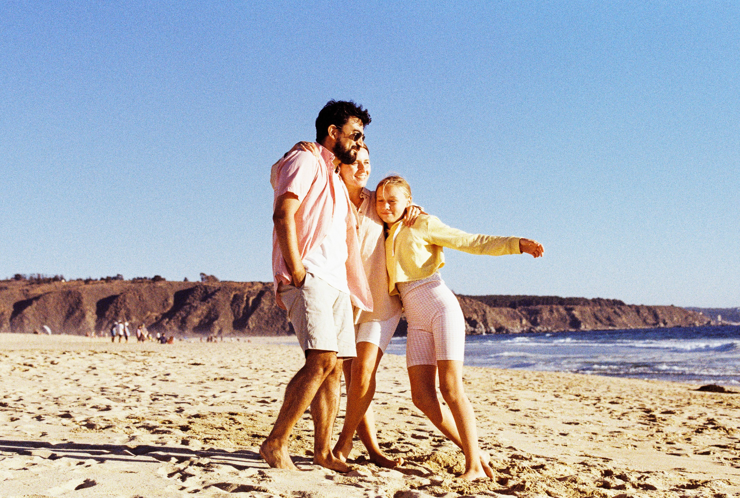 a family is having fun on the beach