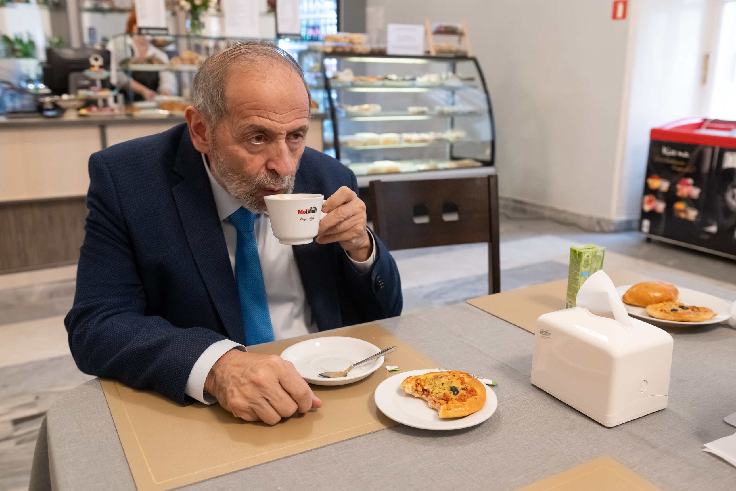 Boris Vishnevsky takes a coffee break in the cafeteria.