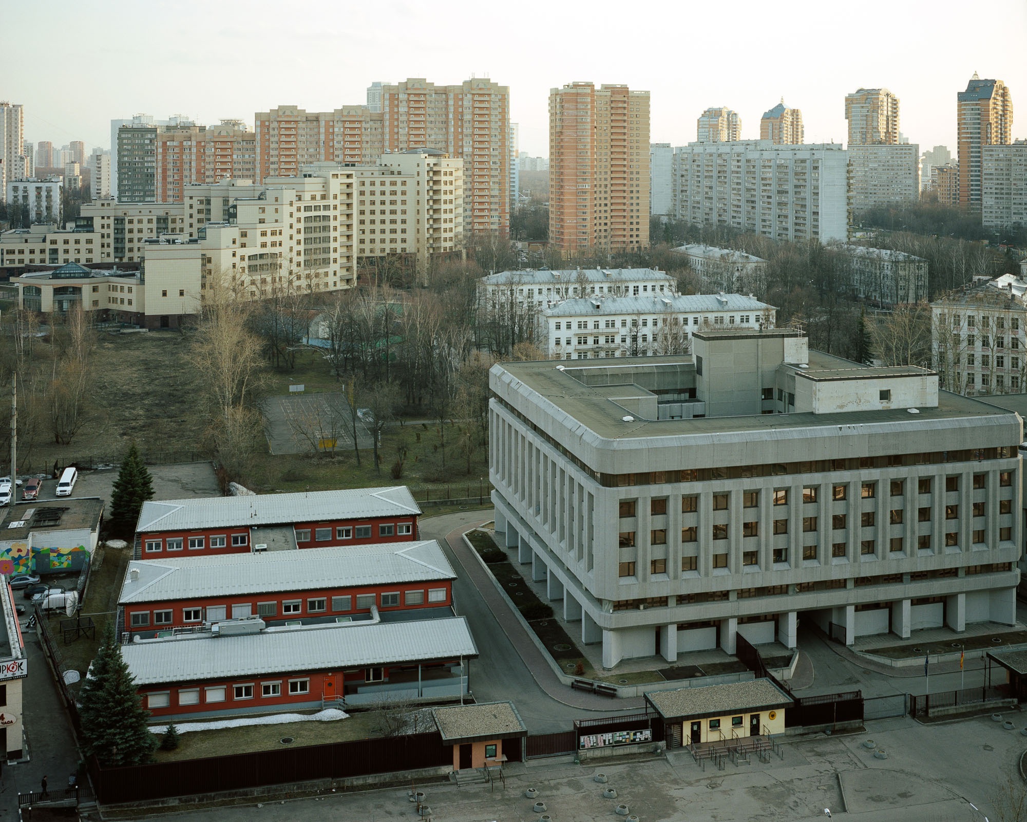 PLATE 34: Concrete office building, modular office buildings, residential buildings, school building 	 	(also includes lawns, notice board, guard house, flower pots, trees, cars)