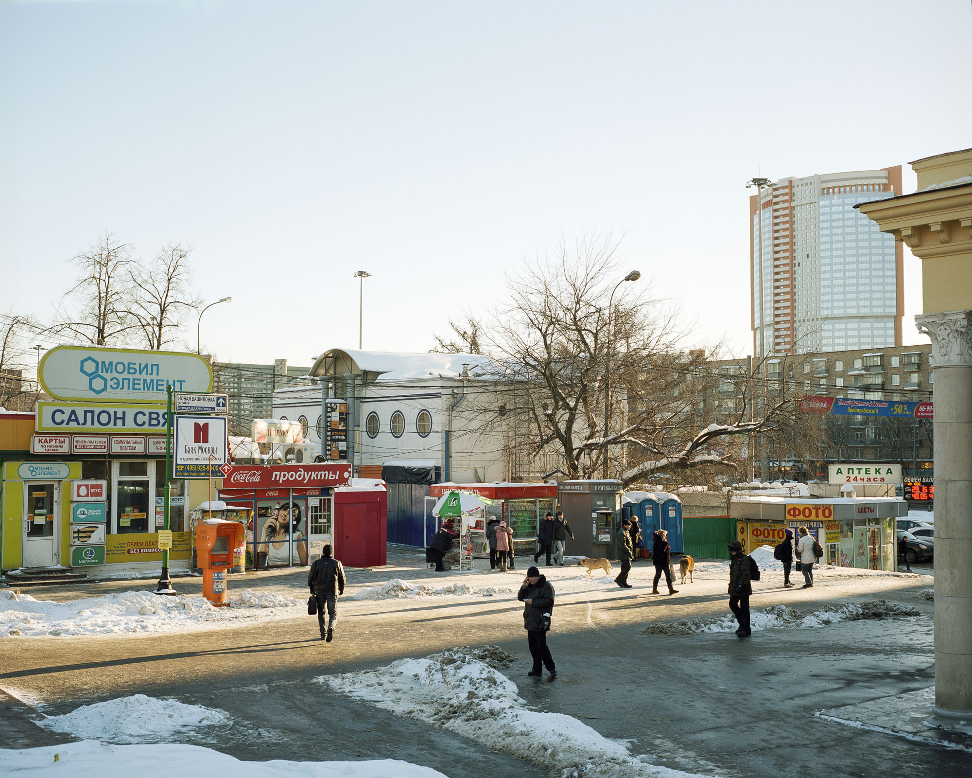 PLATE 48: Assorted semi-permanent shop buildings and kiosks, signs and billboards, banners, assorted pay kiosks, residential buildings, modern office building, trees, lamp posts, A/C units, porta-toilets, parasol, snow, cars, figures of people, figures of dogs