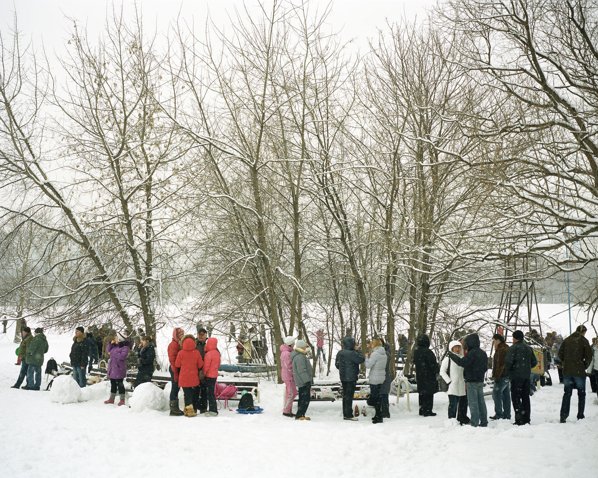 PLATE 49: Figures of people at leisure, trees, benches, wooden watchtower, winter landscape