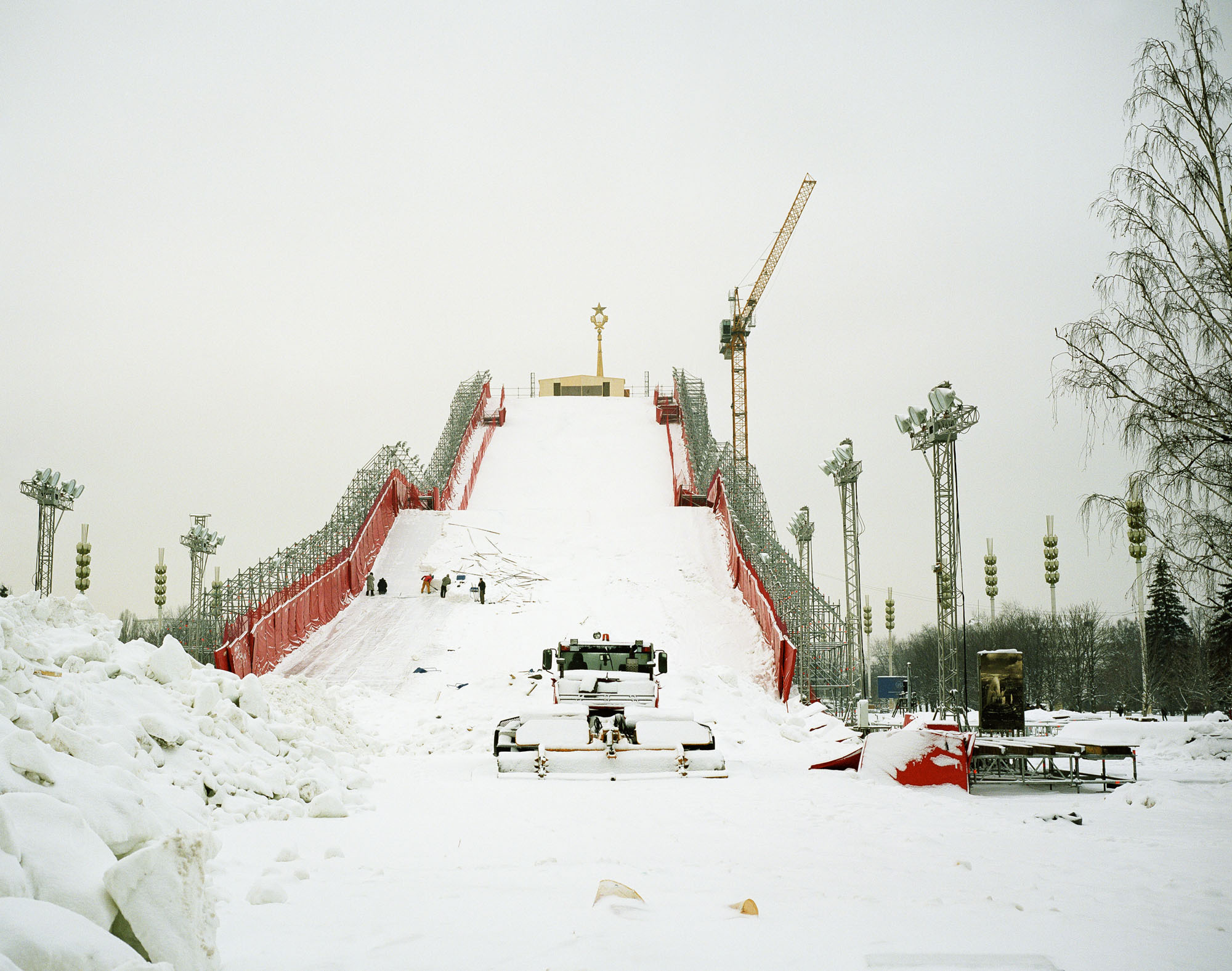 PLATE 14: Ski-slope, construction crane, lighting masts, snowplough, figures of people, snow piles, scaffolding, trees
