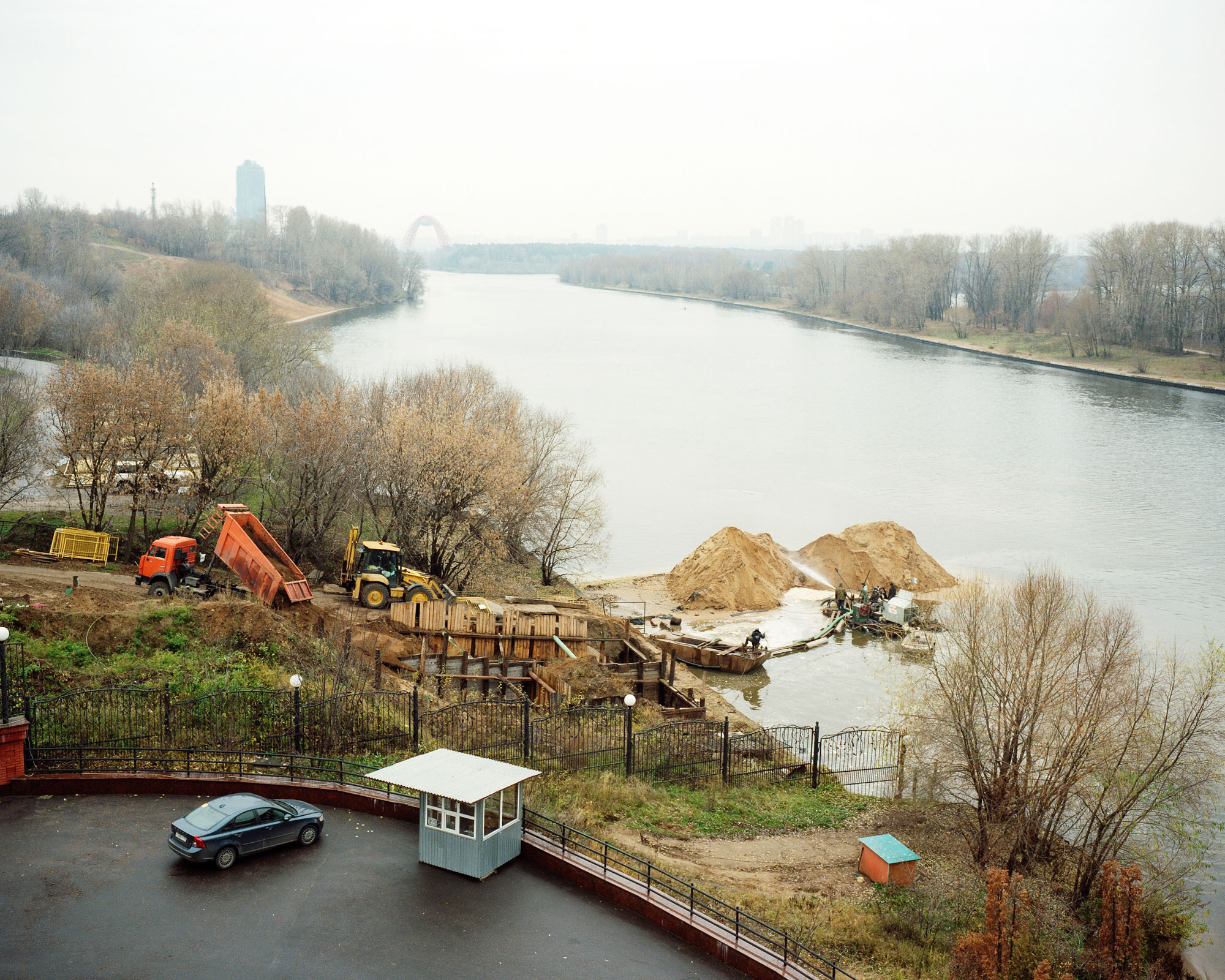 PLATE 54: Water reservoir, sand piles, heavy machinery, car, guard hose, assorted barriers and guardrails, trees, 	construction tools and equipment, figures of workers