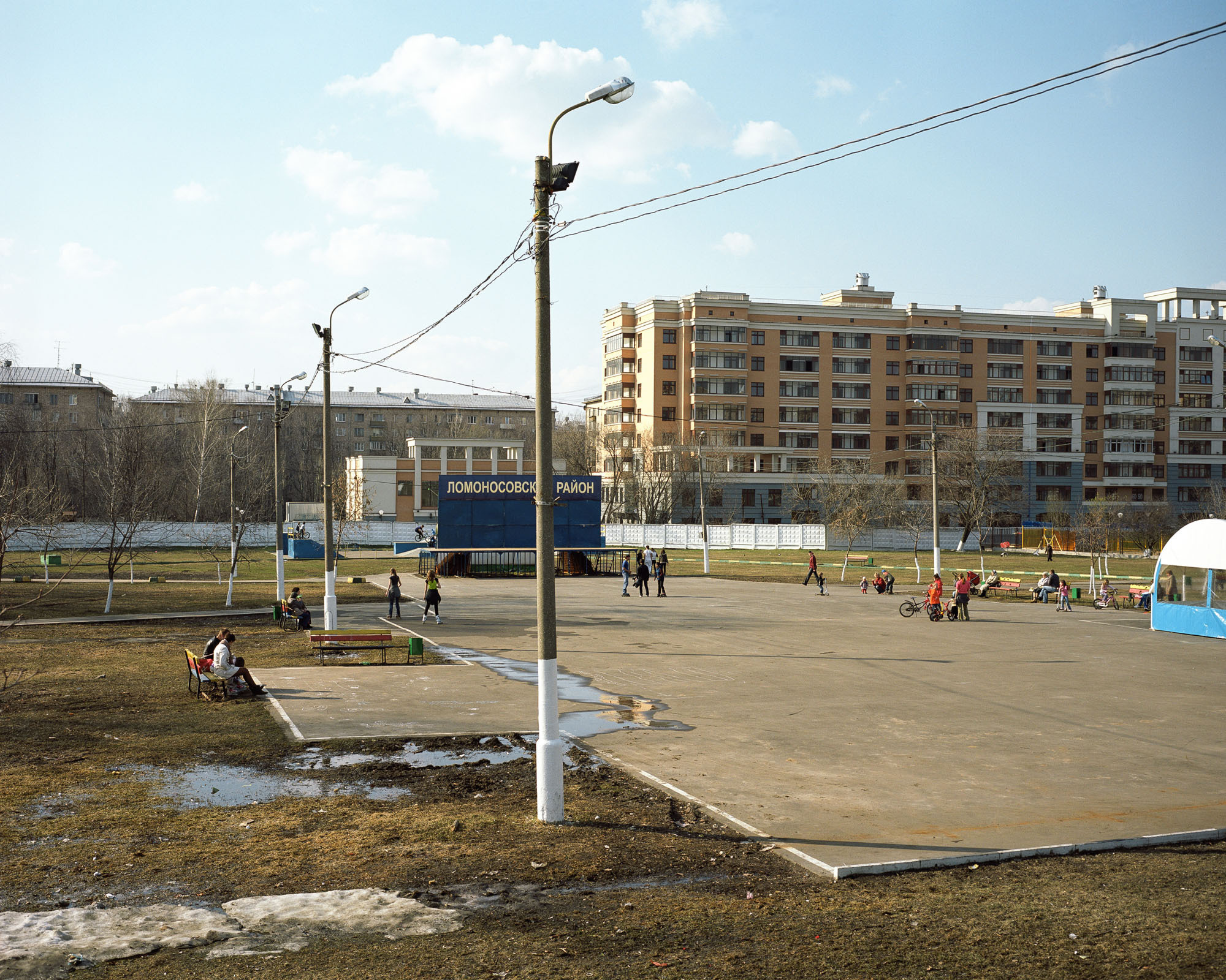 PLATE 33: Residential buildings, lamp posts c/w power lines, café tent, outdoor stage, skate ramp, benches, waste bins (also includes figures of people at leisure, bicycles, trees, grass, modular concrete wall)