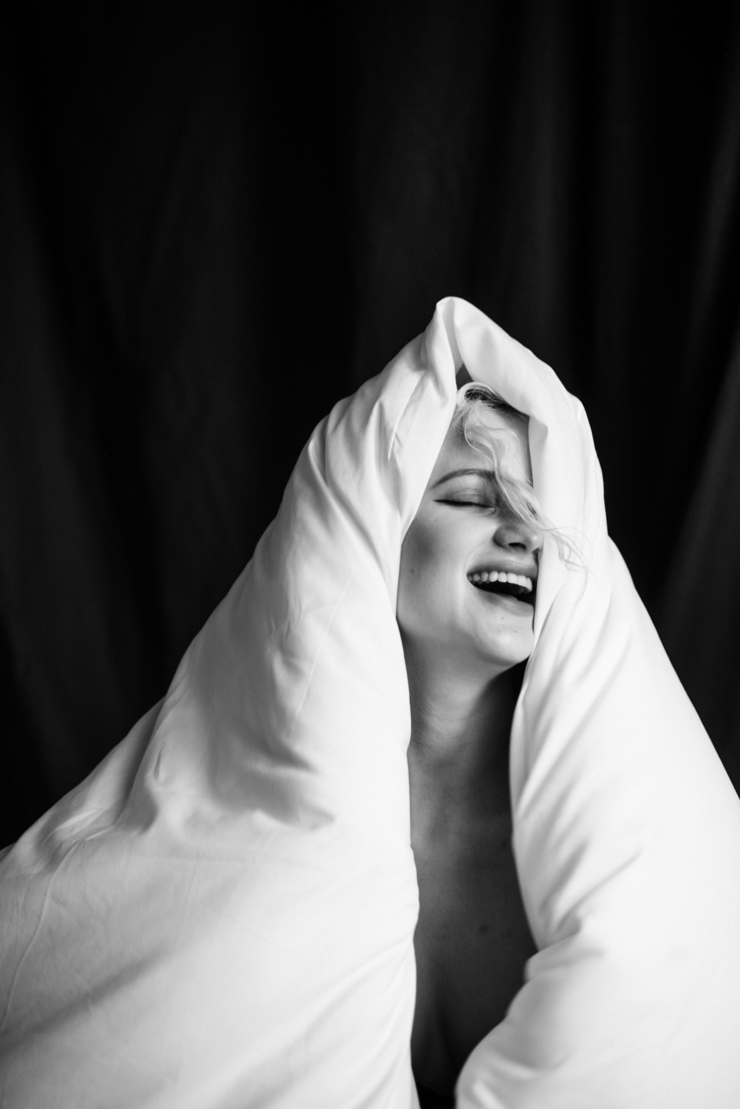 mindful  close-up of hands holding a duvet, symbolic and intimate detail