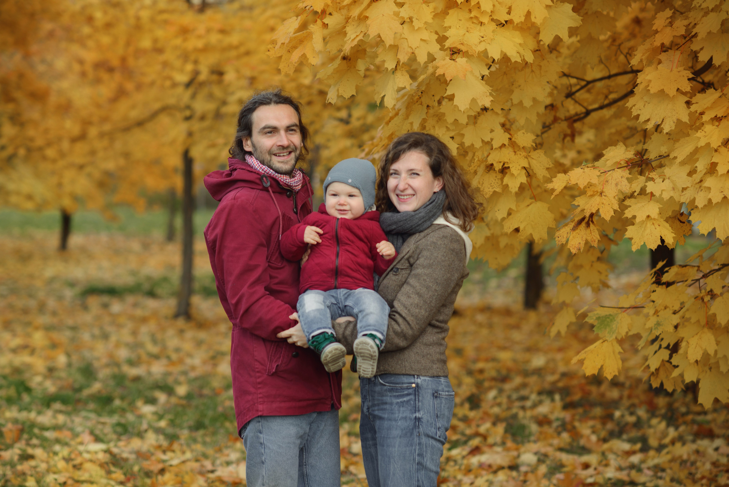 Family photo shoot in autumn. Photos with yellow leaves