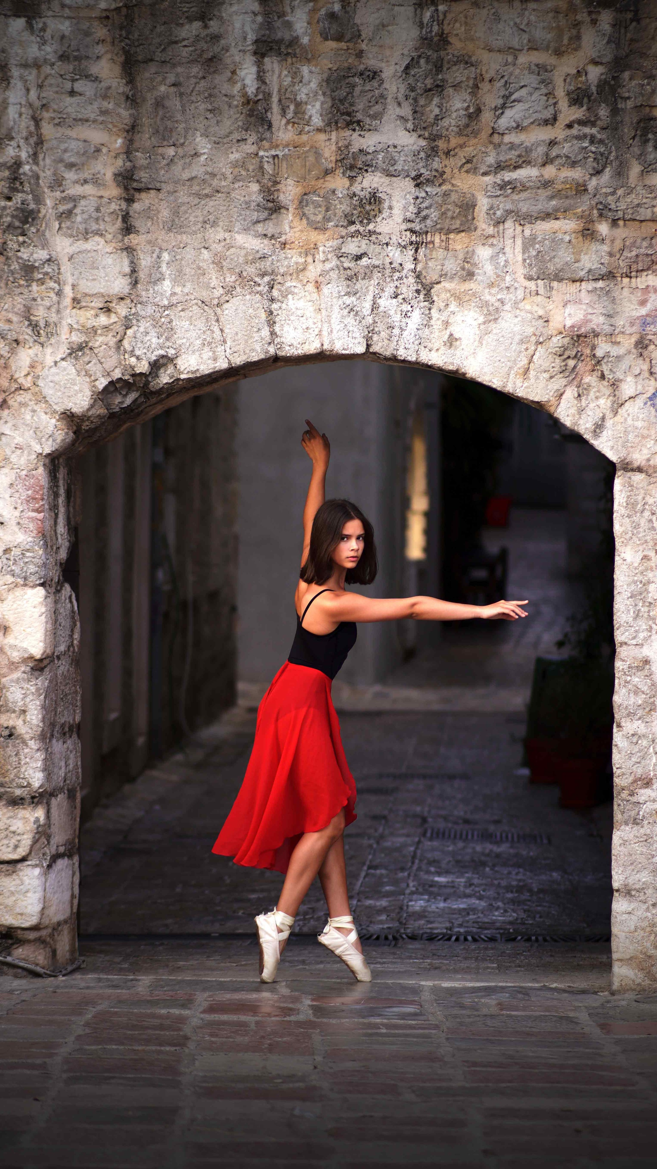 Graceful ballerina movement in Budva Old Town