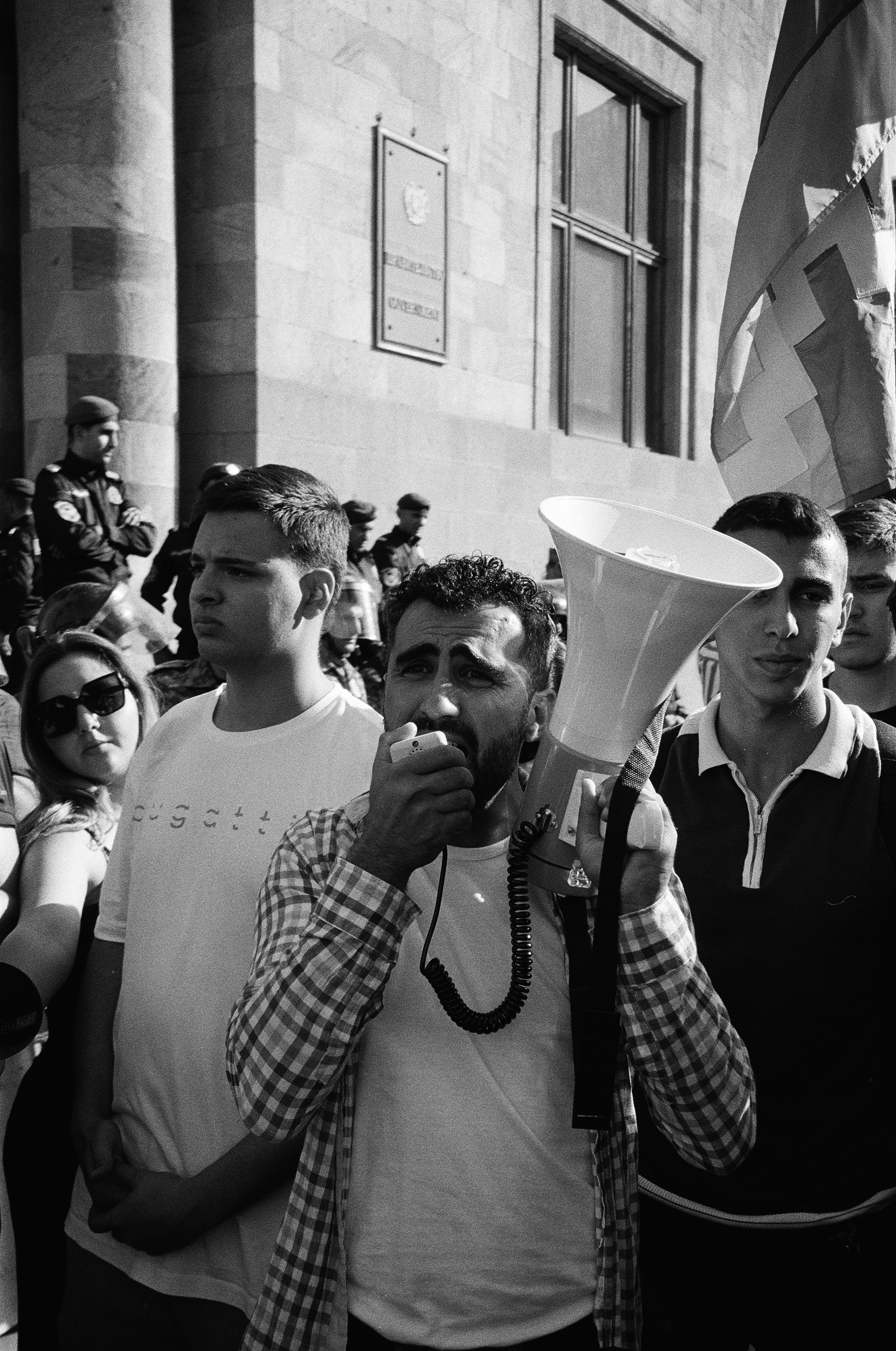 A man is addressing the protesters