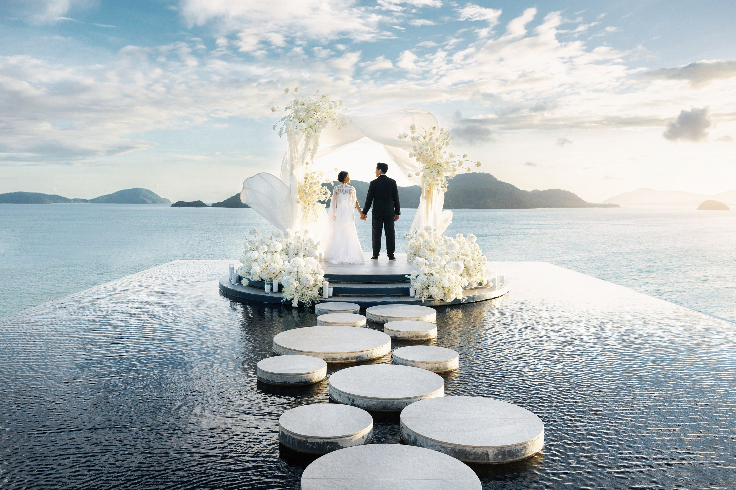 Bride and groom against the backdrop of the sea in Sri Panwa Phuket