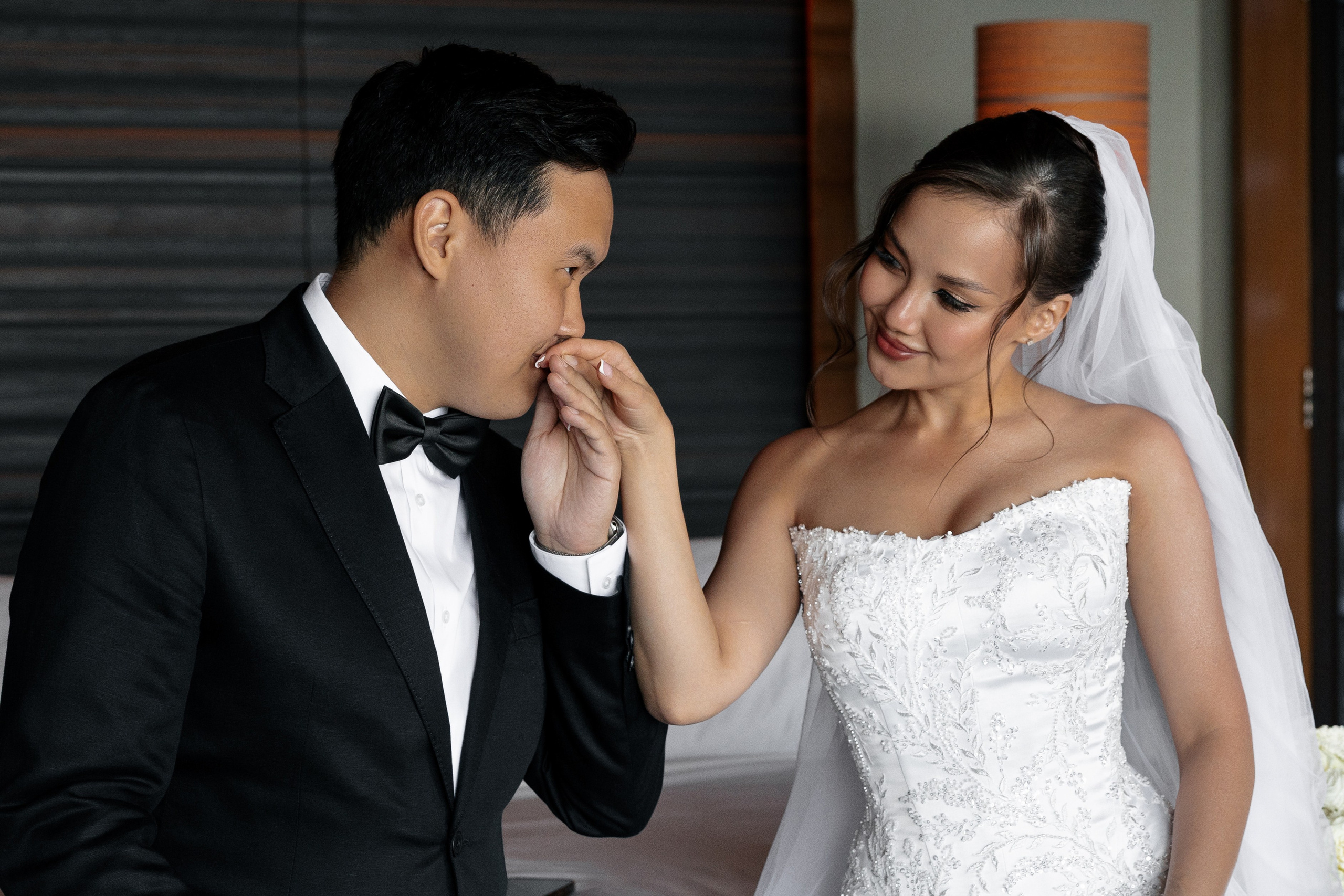 the bride and groom smile at each other
