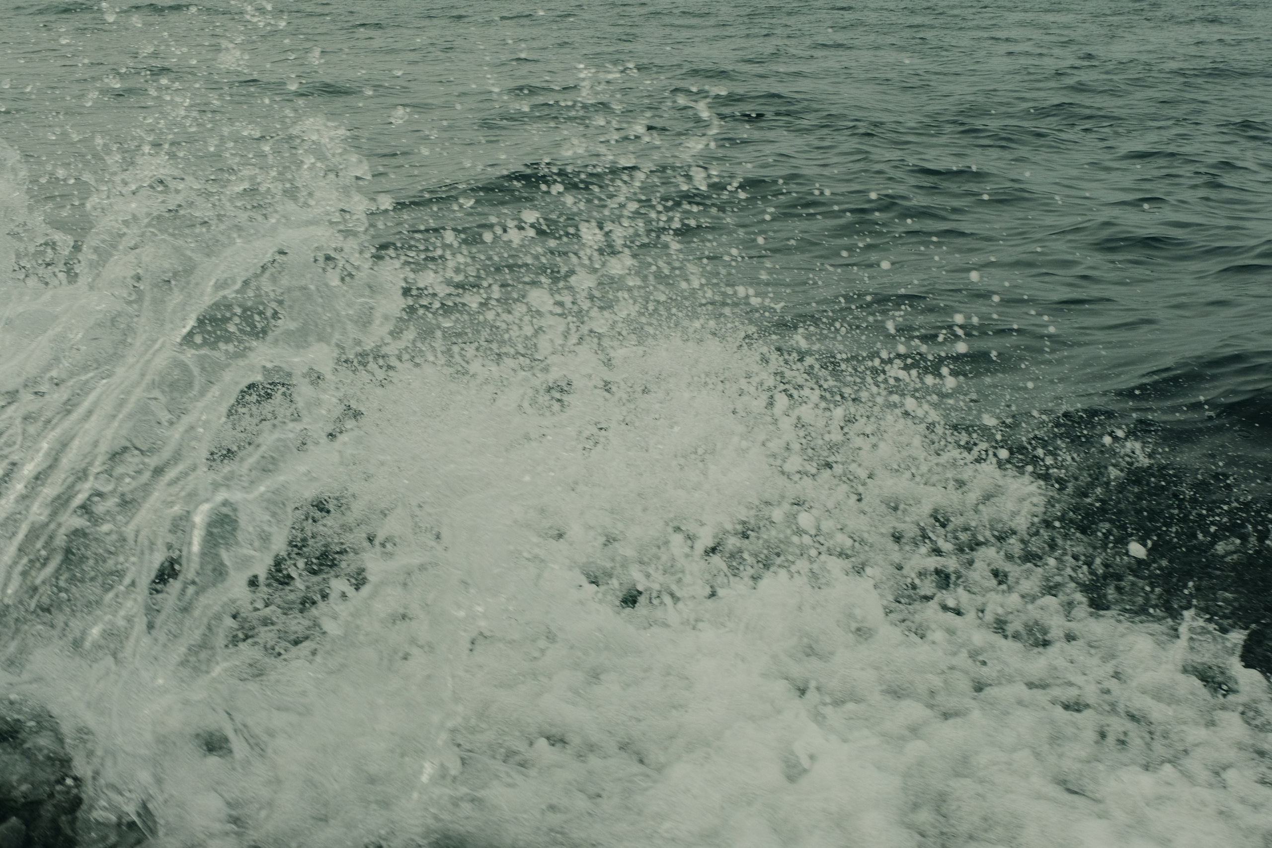 splashes of water from a passing boat