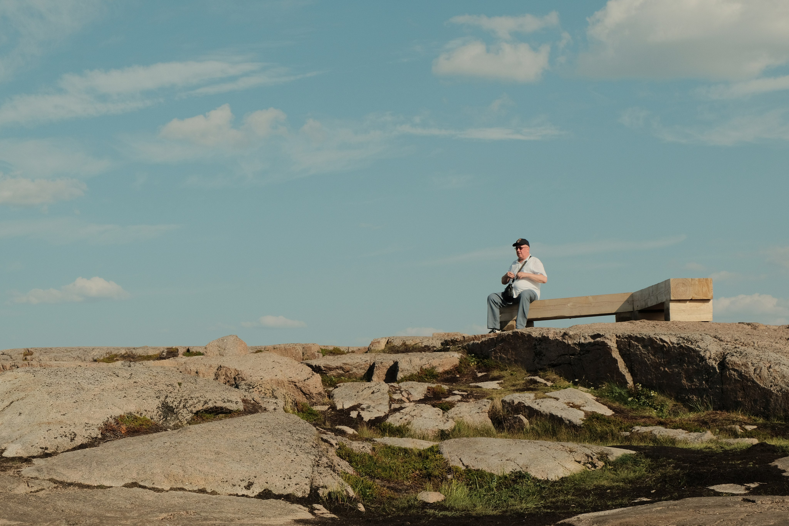 man sitting on a rock