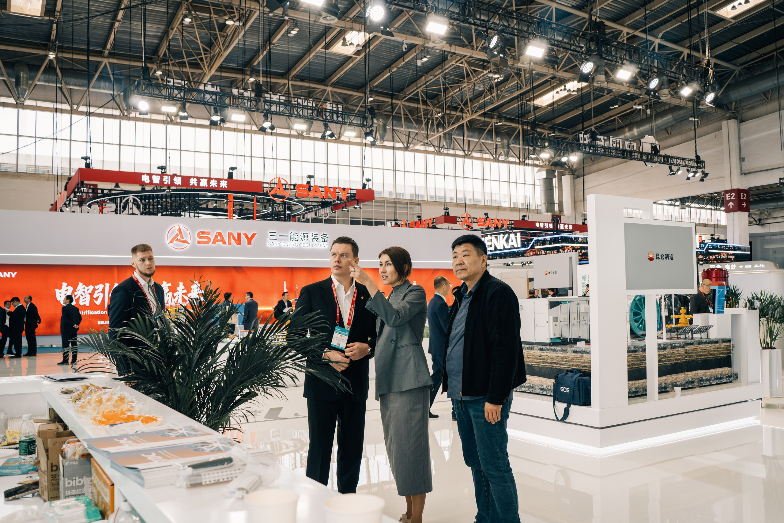 Business trip to China — Oil Resource delegation studying oil and gas equipment at the cippe exhibition.