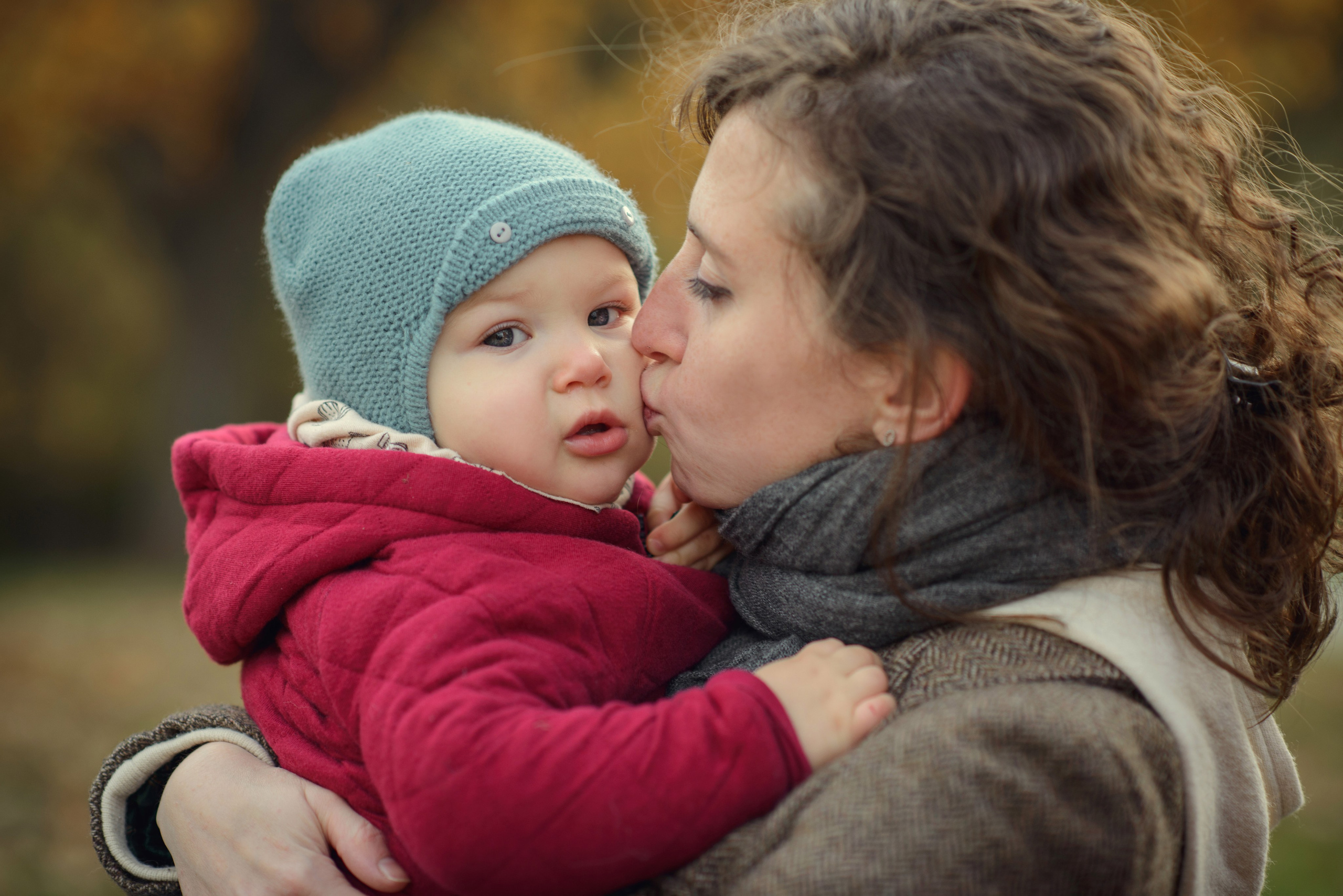 Mom and baby in autumn. Photos with yellow leaves
