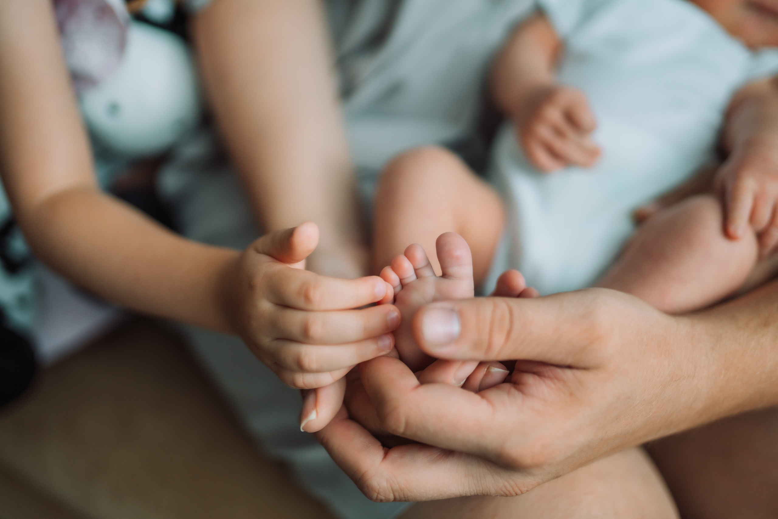 Close-up of baby feet right after delivery — timeless birth photo