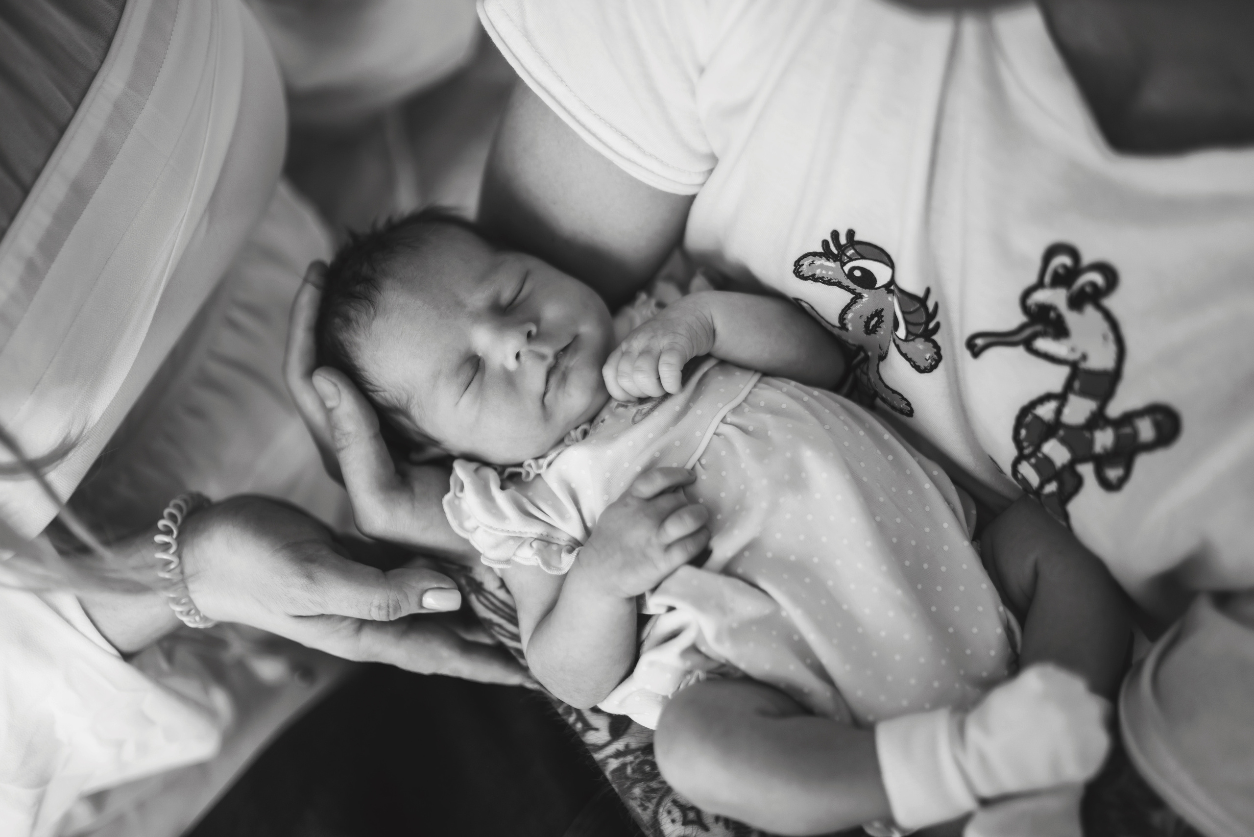 Tender newborn moment included in birth photography pricing package