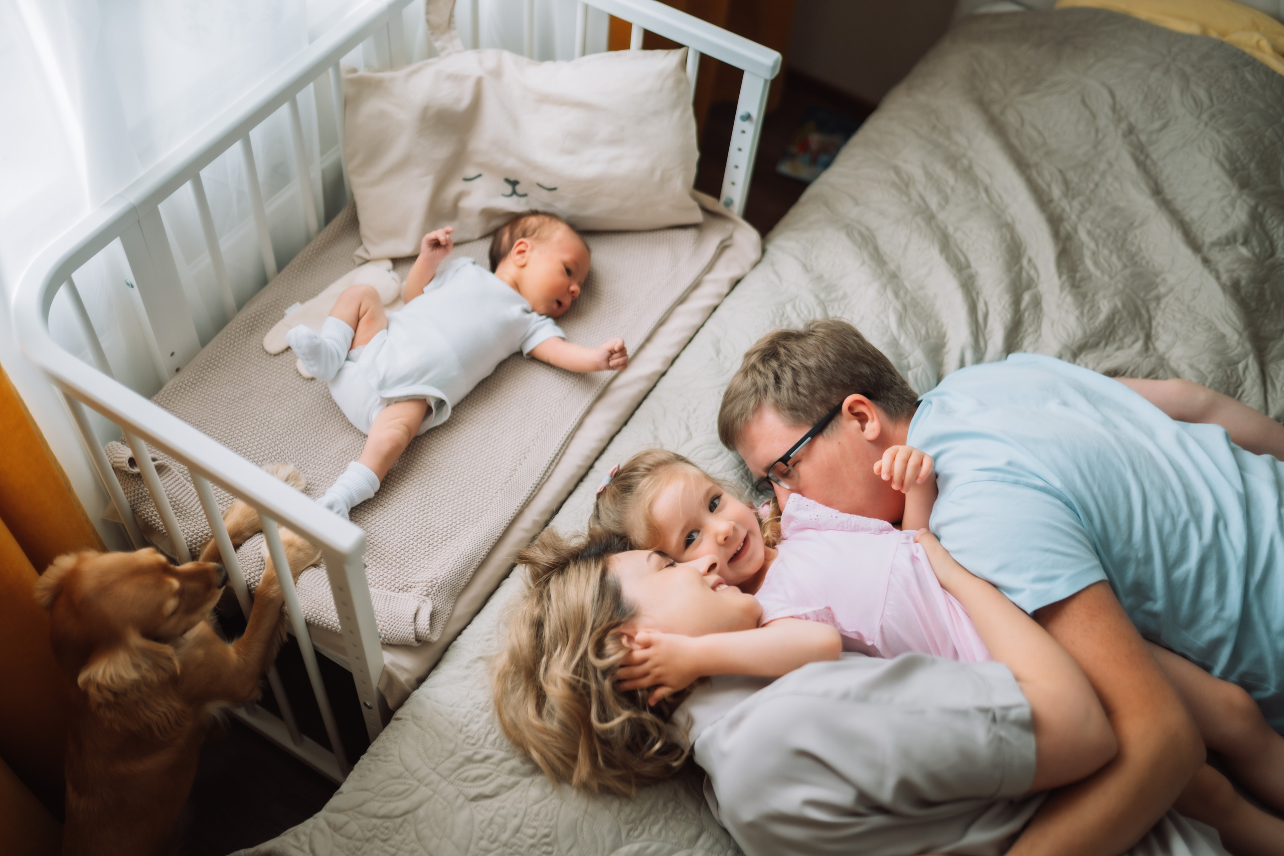 Candid family moment after a home birth photoshoot
