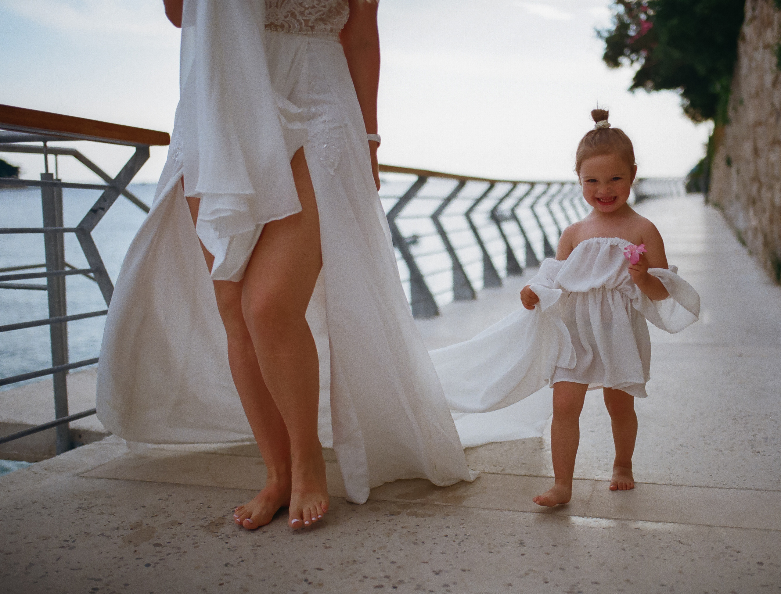 a daughter carrying mother's wedding dress
