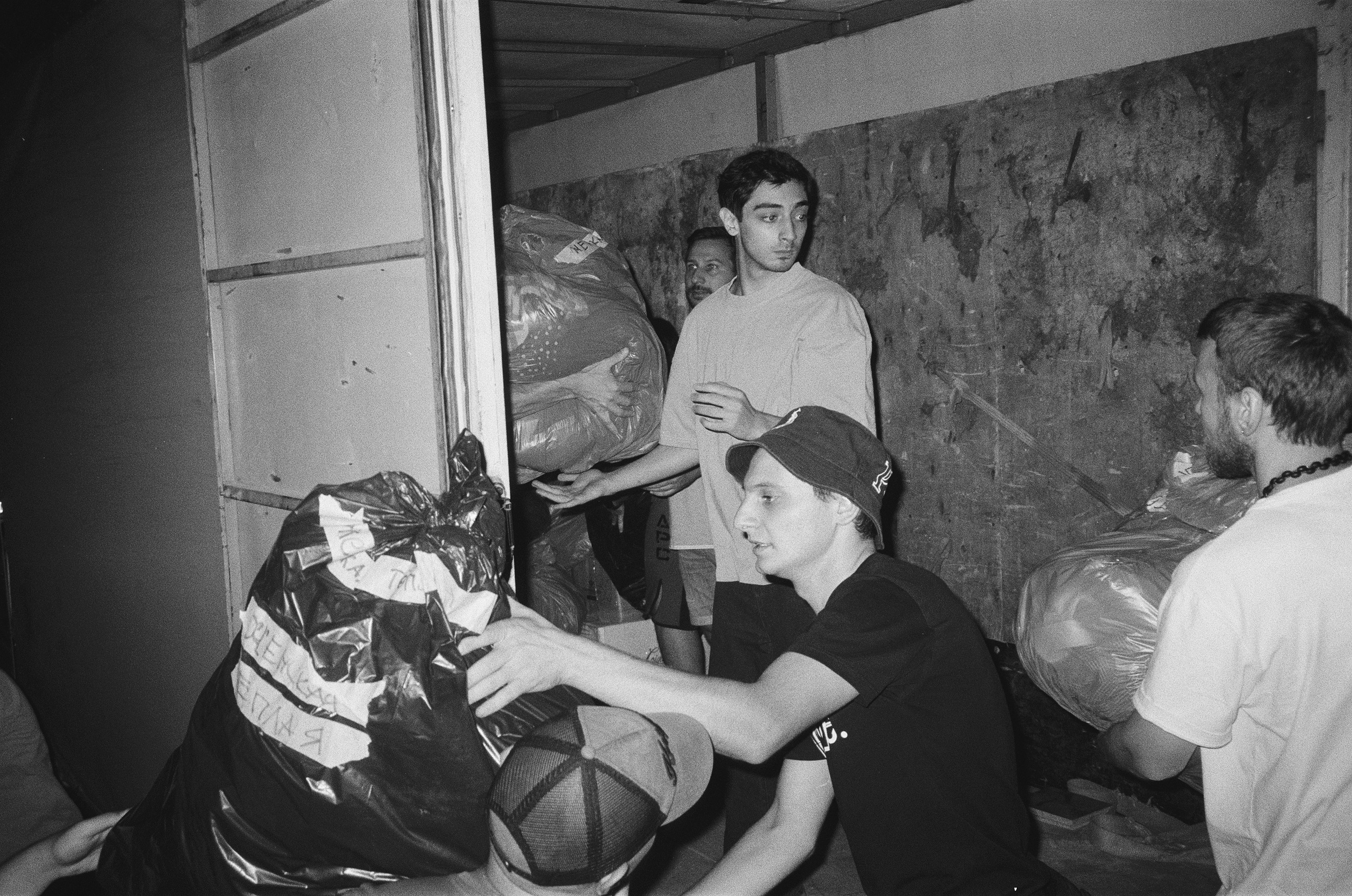 Volunteers are loading a truck with humanitarian aid