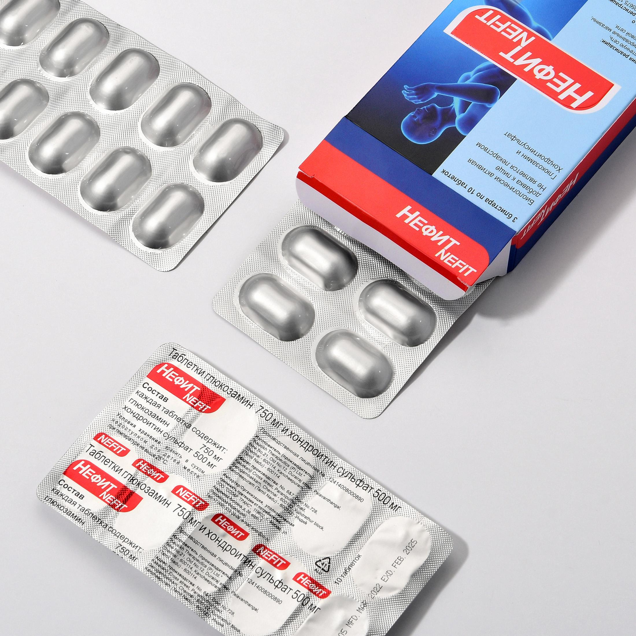 Пищевая добавка, БАД, лекарство, капсулы, блистеры на сером фоне.