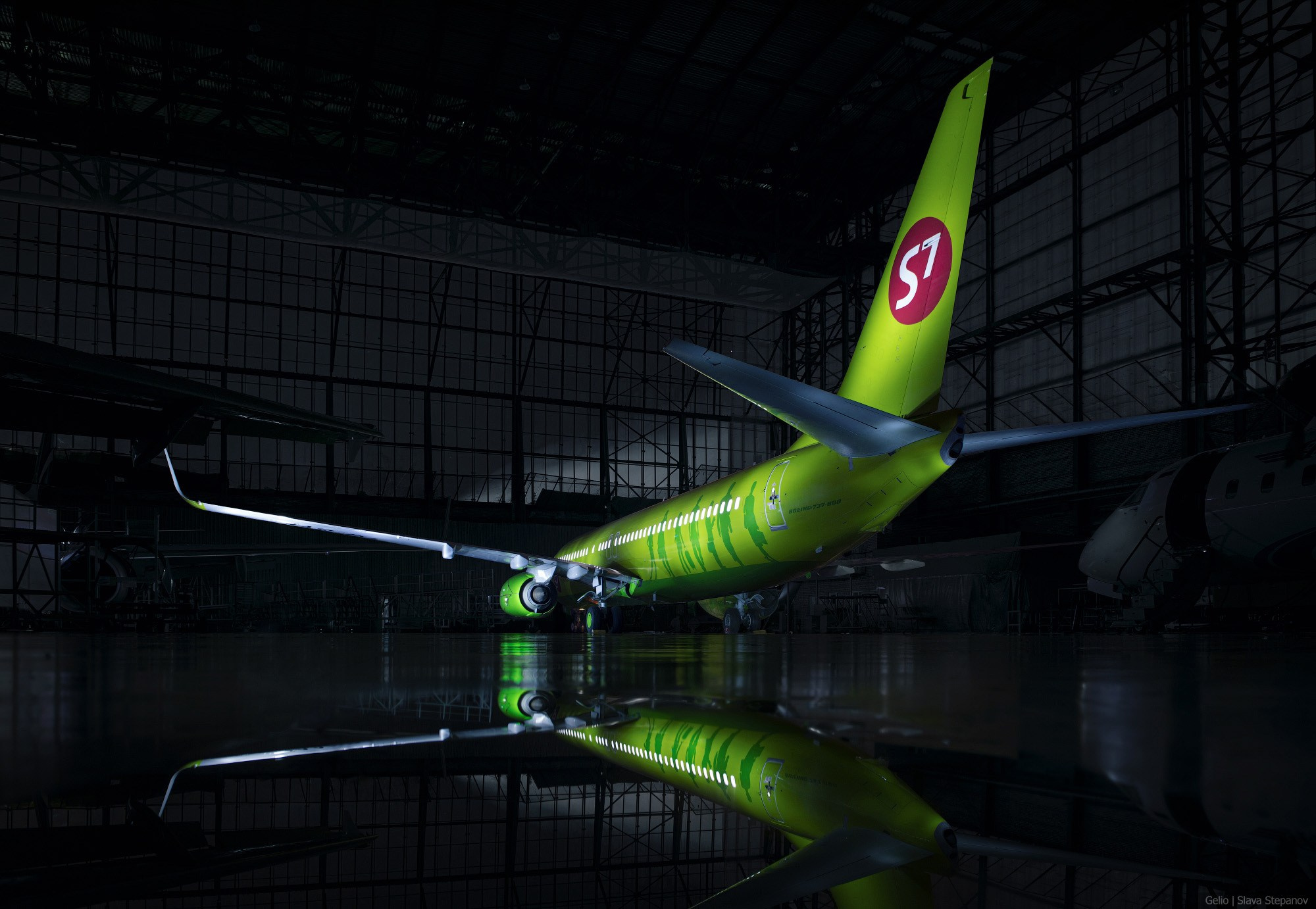 Passenger Aircraft in a Nighttime Hangar