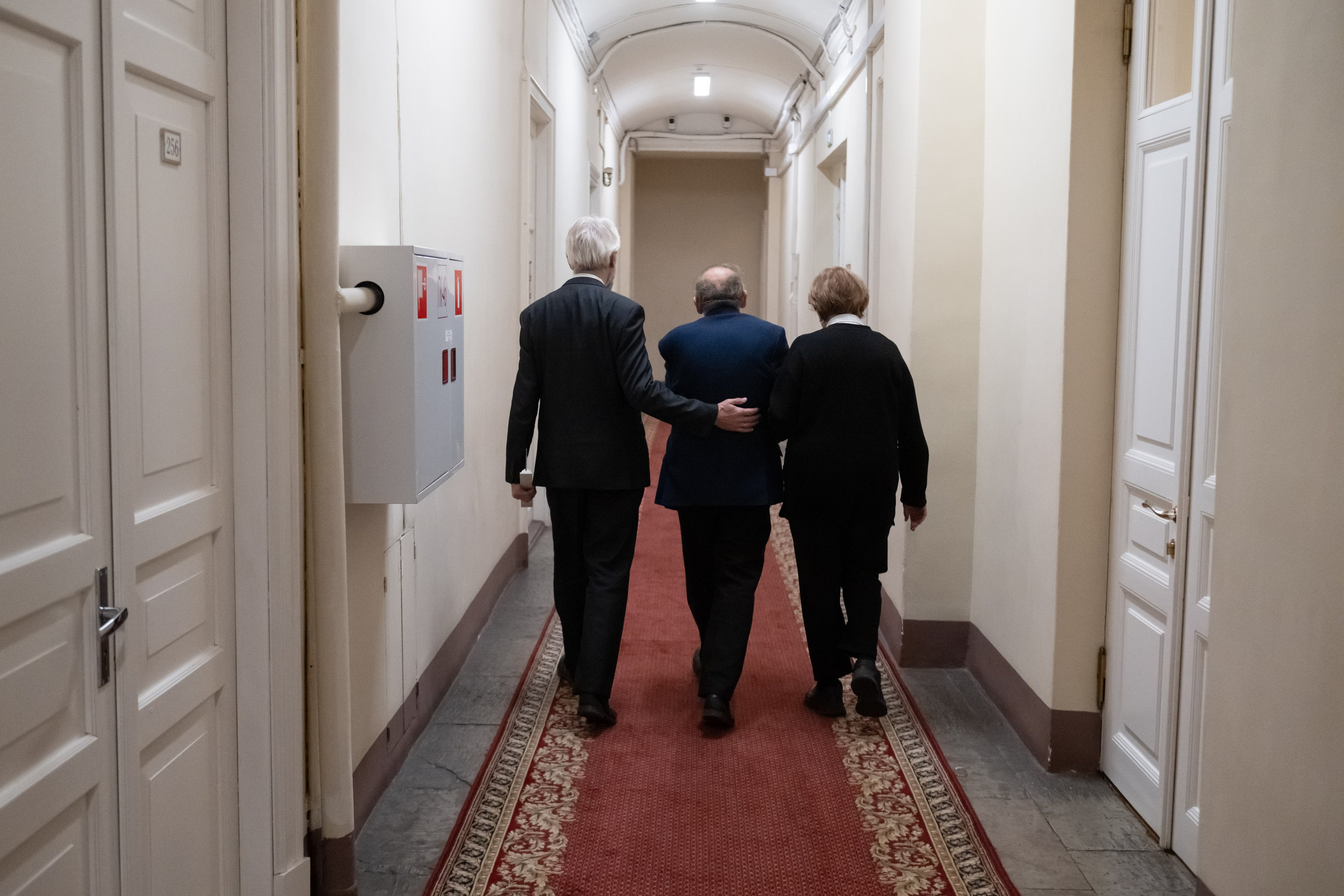 Boris Vishnevsky’s colleagues escort him to his office after he announced his departure and delivered his farewell speech.