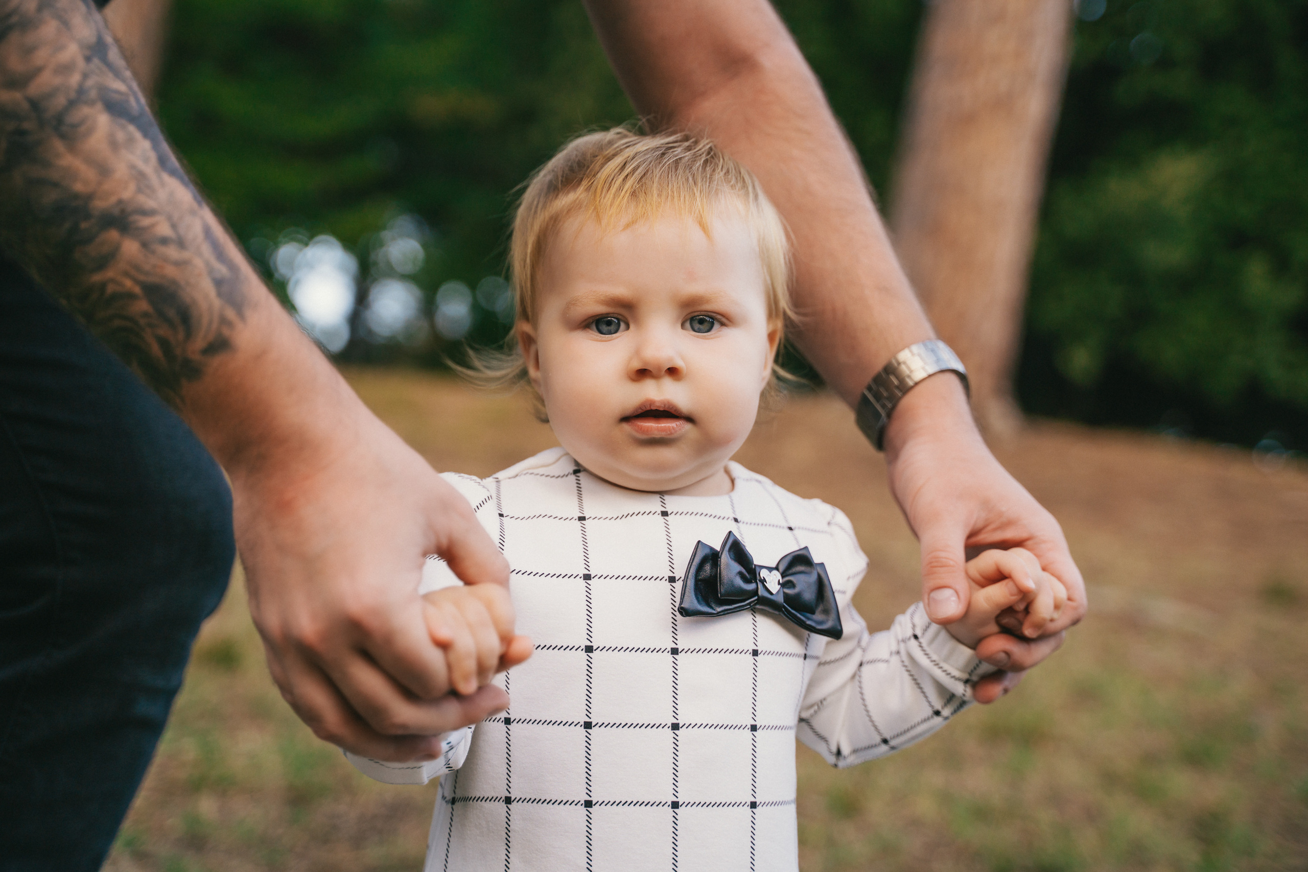 Happy playtime as the child and their dad enjoy outdoor activities in a Montecatini park.