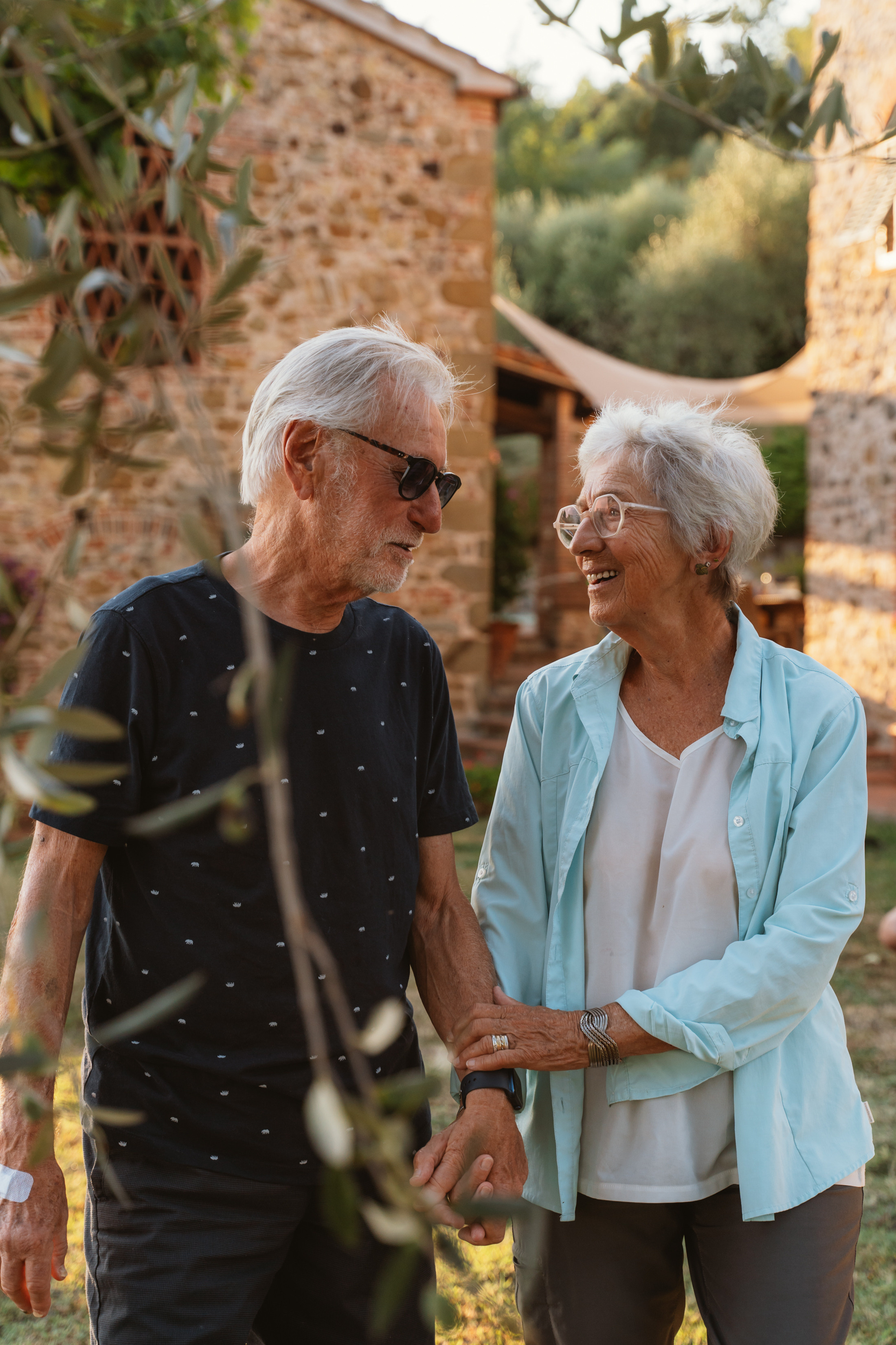 Golden hues of the sunset illuminate the faces of the family as they enjoy a peaceful walk