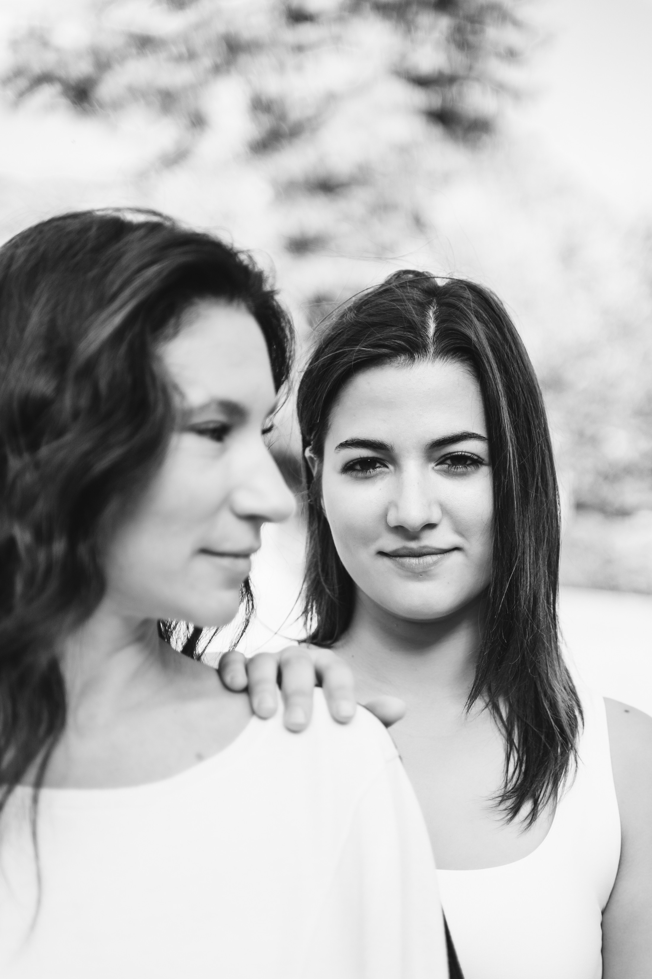 A loving mother and her daughter share a beautiful family portrait, radiating happiness and togetherness.