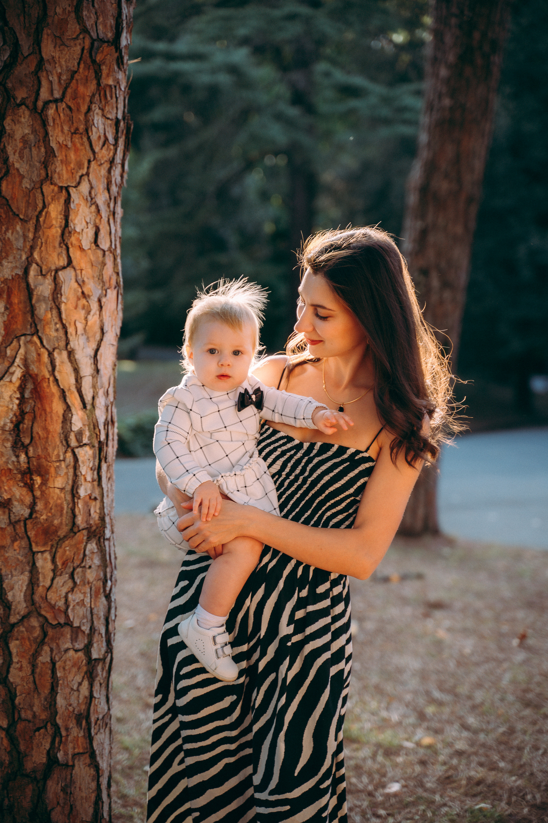 Heartwarming moments mom the child in a charming Montecatini park, sunset moments in Tuscany