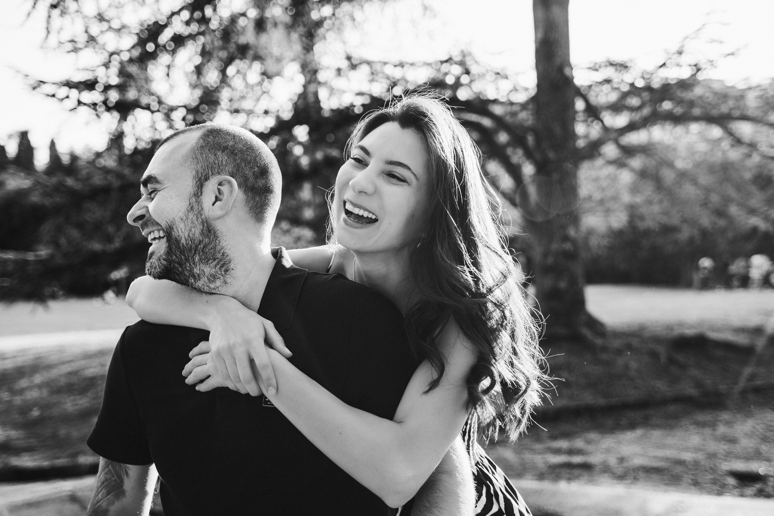 The family takes a walk through the picturesque Tuscan countryside as the sun sets in the background.
