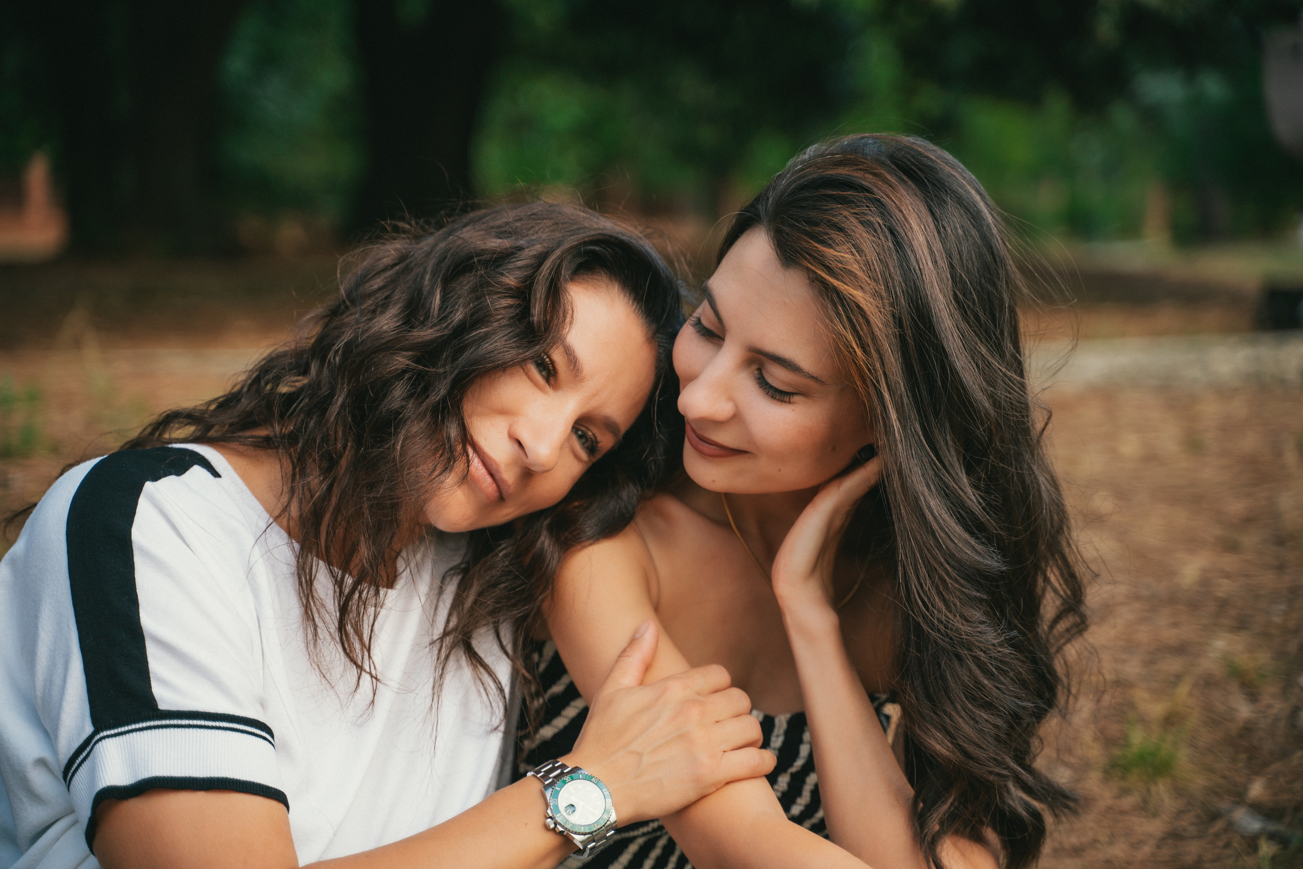 Two sisters gather for a heartwarming family photoshoot, showcasing their strong bond and connection