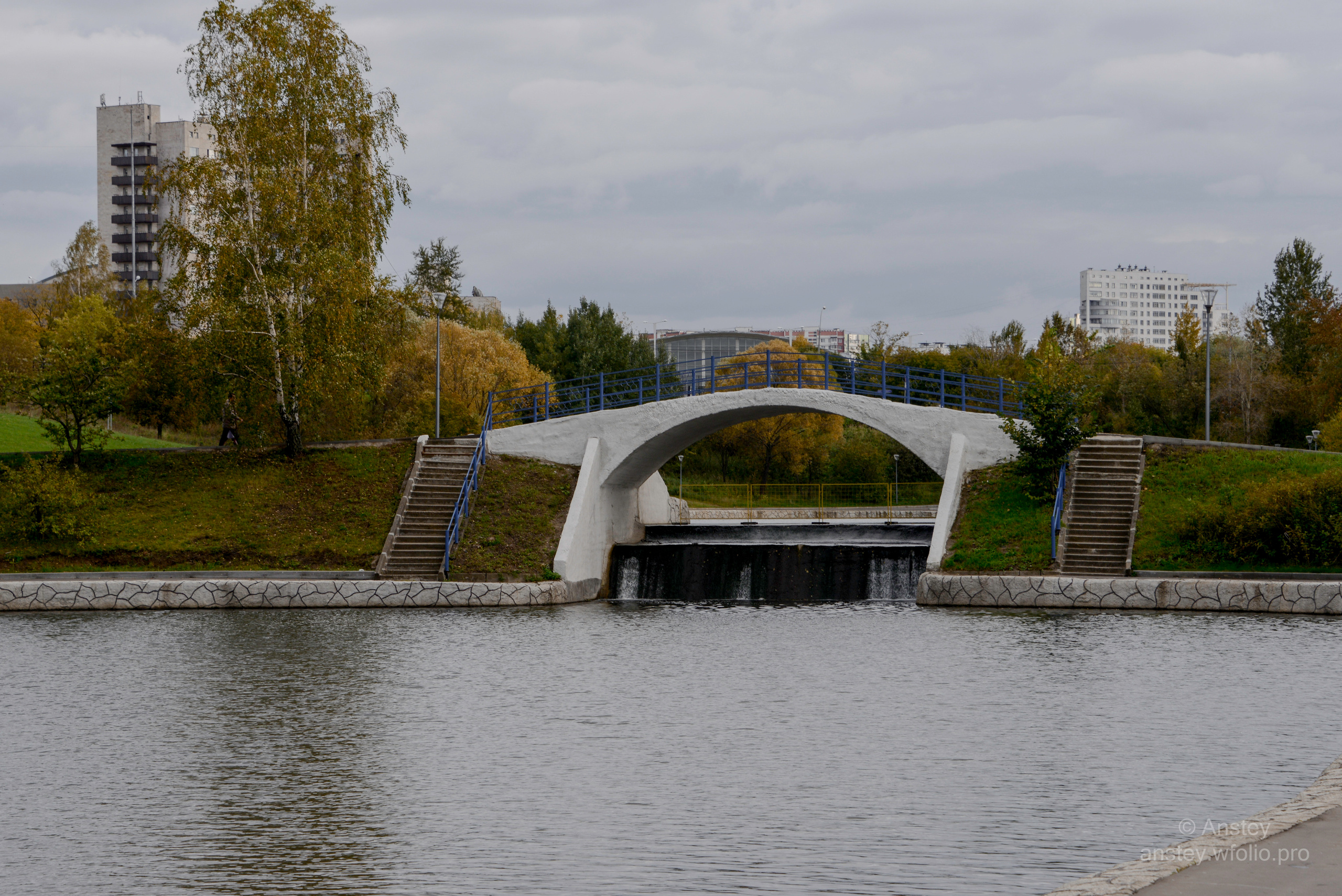 View of bridge over river against cloudy sky