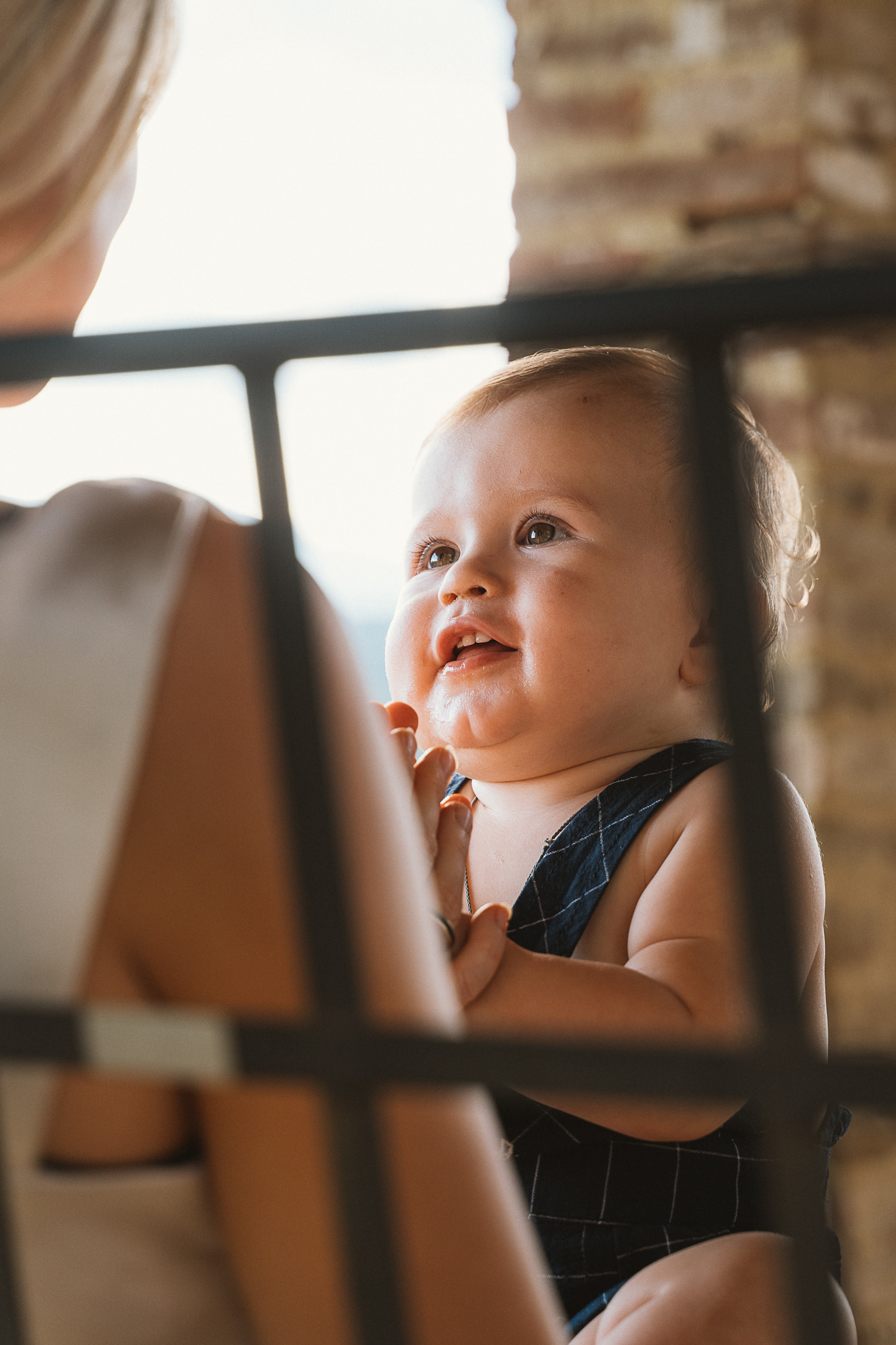 Mother and son share a special moment in the scenic Tuscan countryside, creating beautiful memories together
