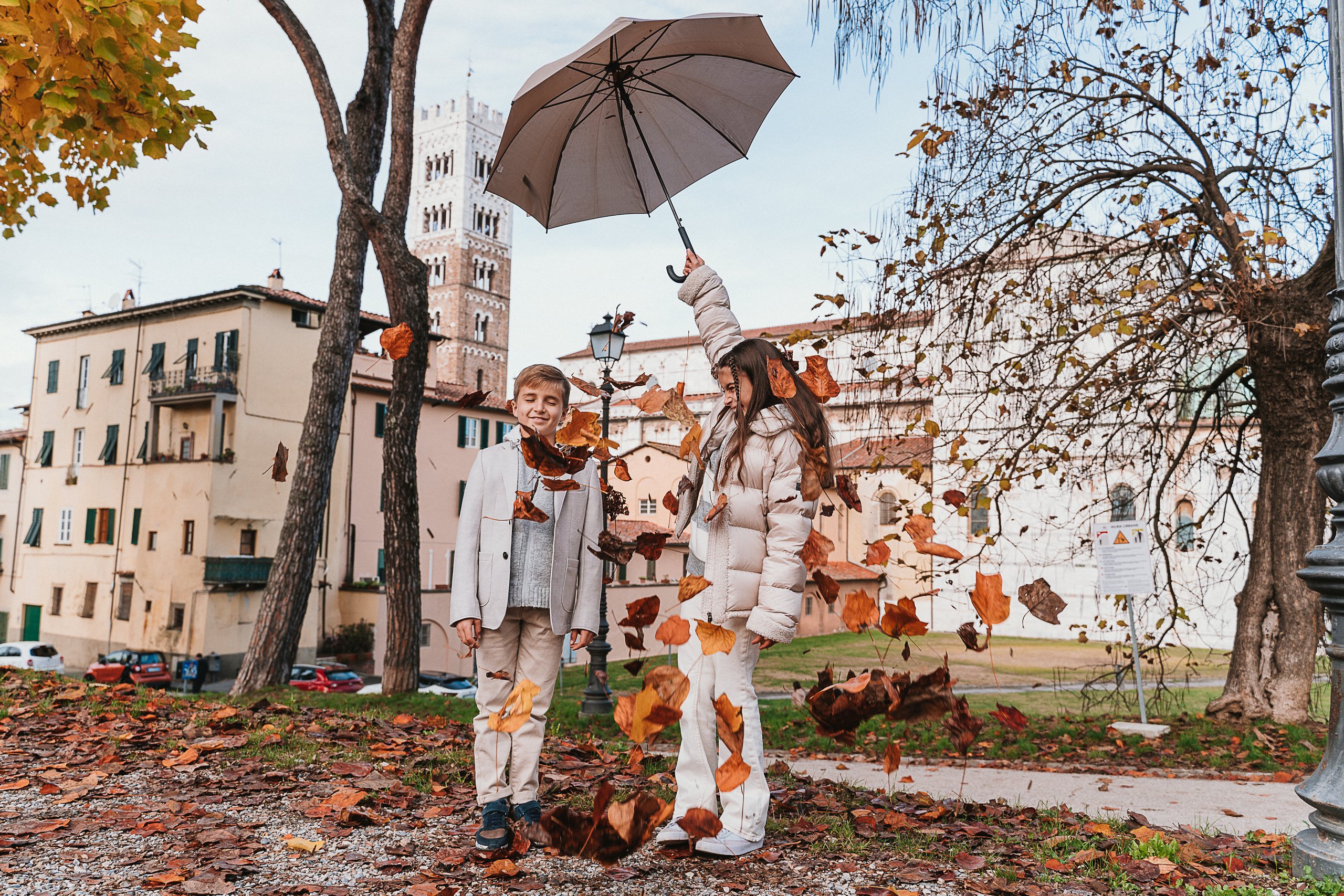 Enjoying a leisurely walk along the well-preserved city walls, lined with trees