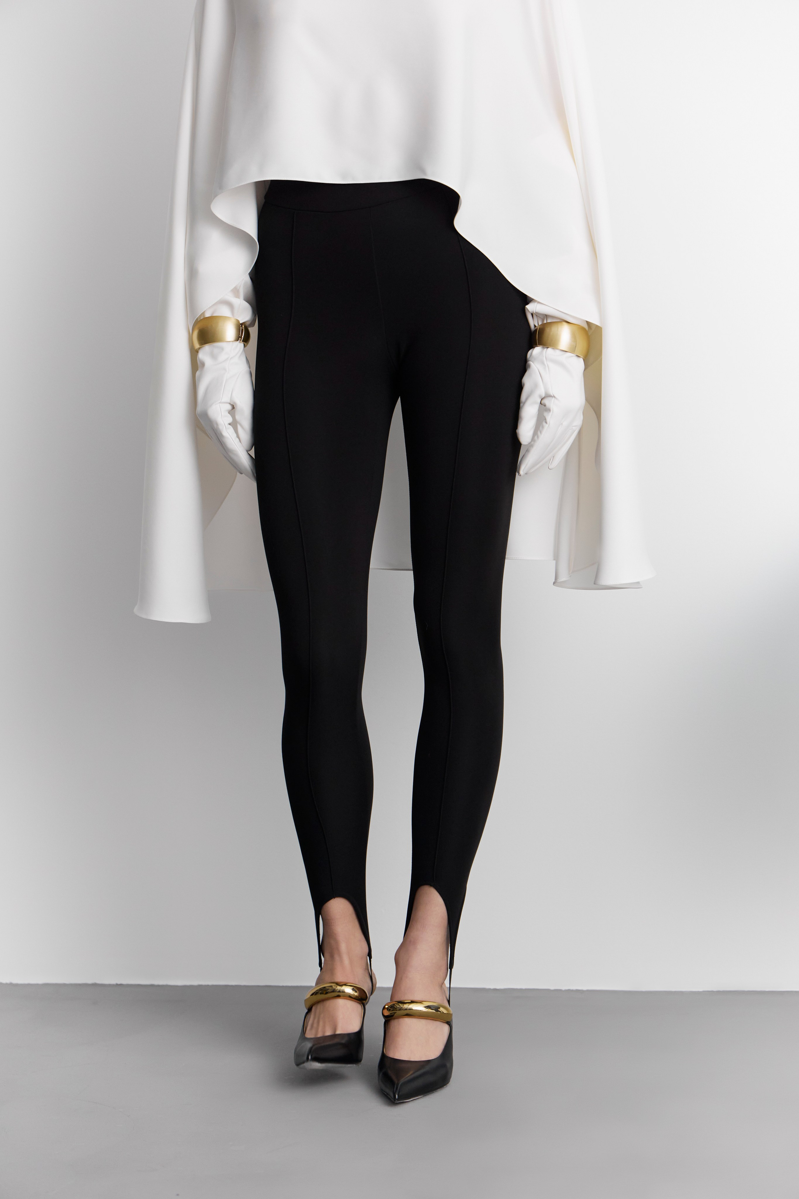 Minimalist fashion lookbook full body styling detail with black trousers and sculptural white top photographed for fashion brand campaign in Sydney