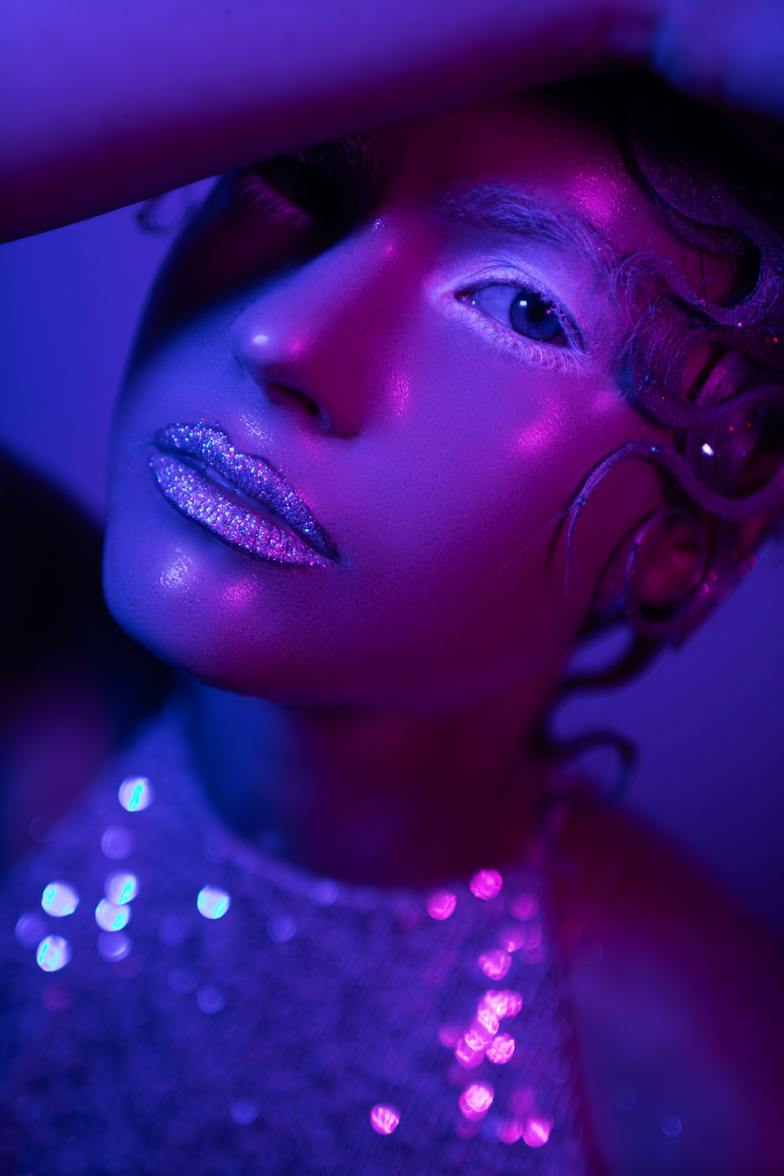Creative portrait session in studio with neon lights in Delray Beach