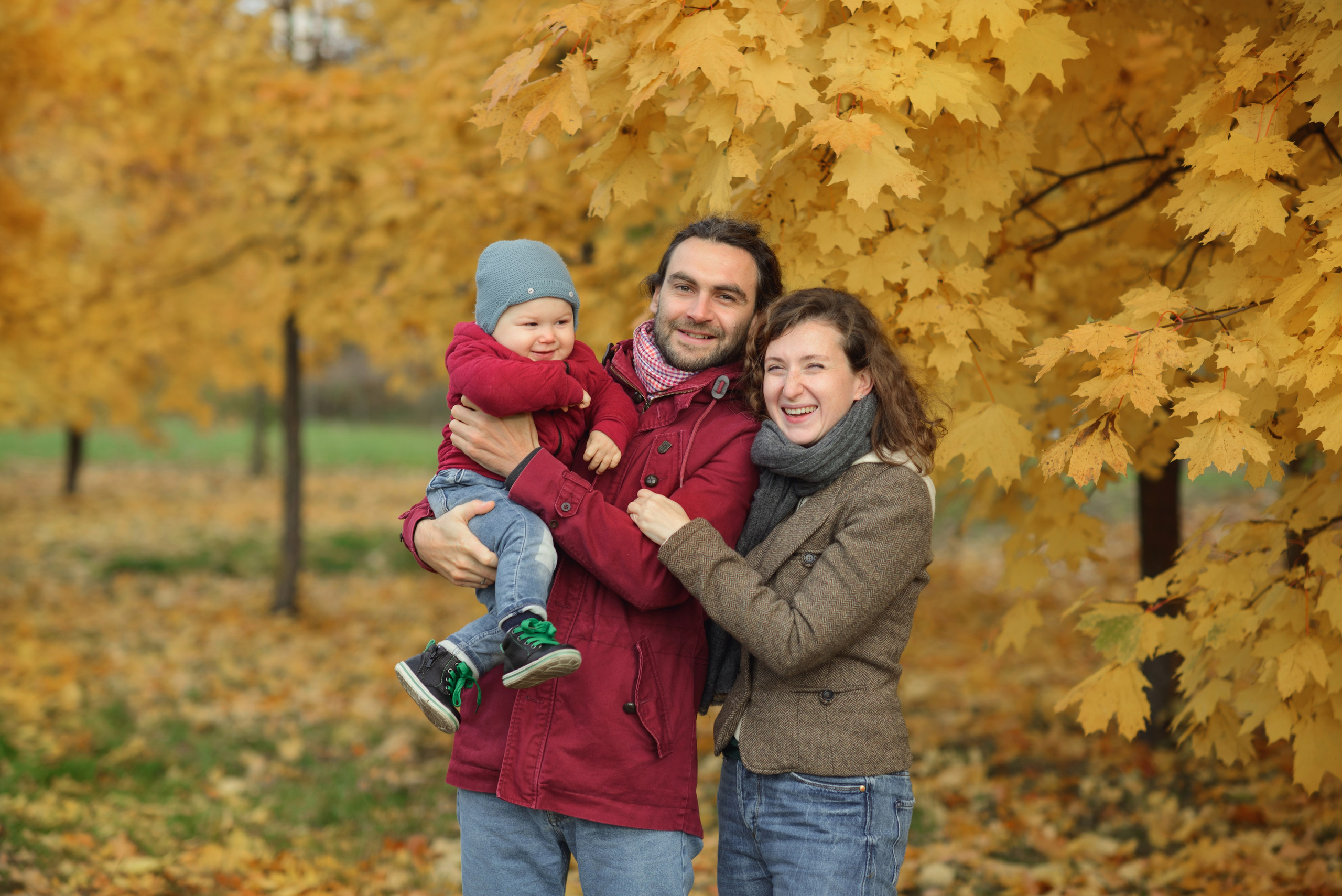 Family photo shoot in autumn. Photos with yellow leaves