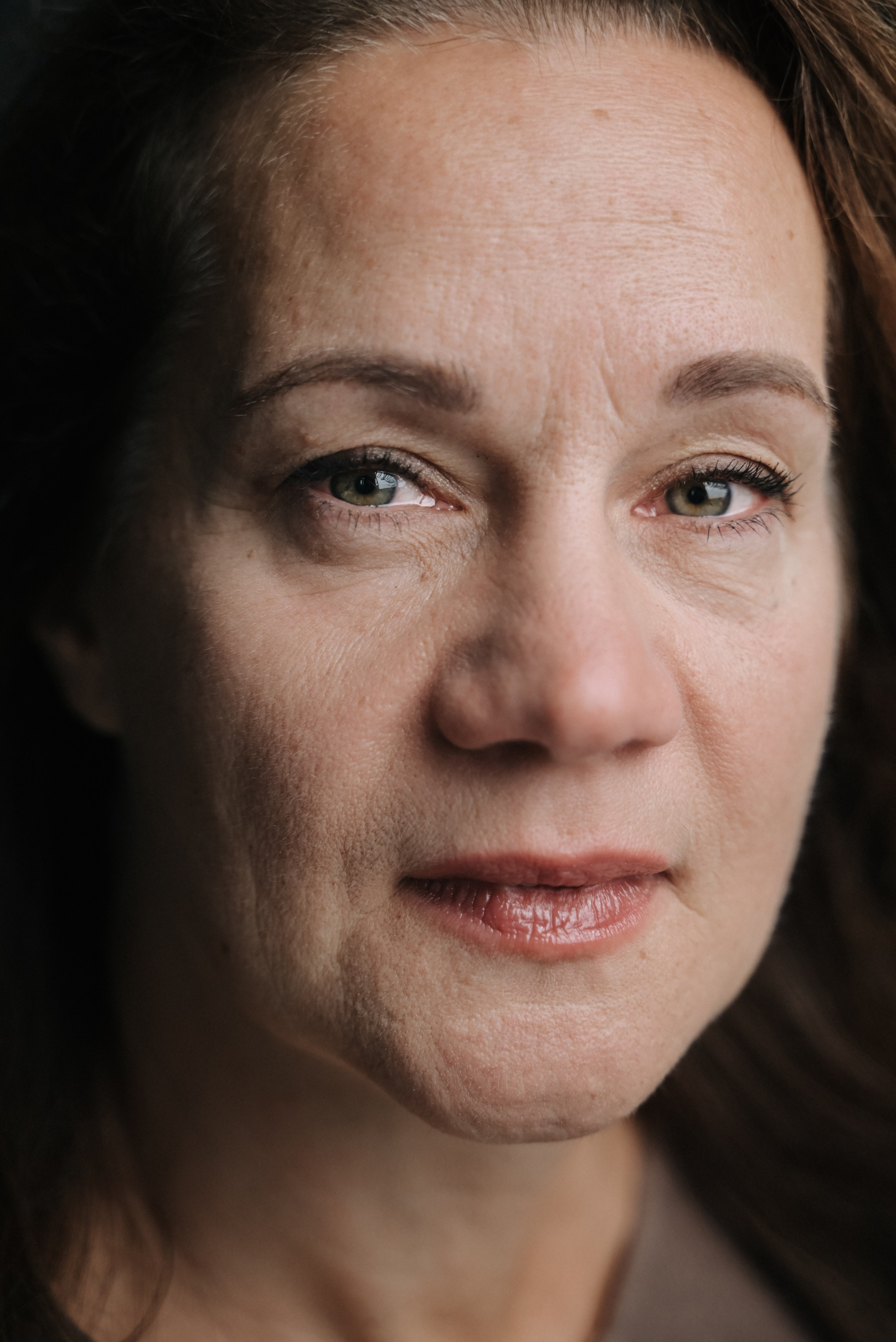 Empowering photoshoot natural close-up with bare face and direct gaze, mindful and authentic presence