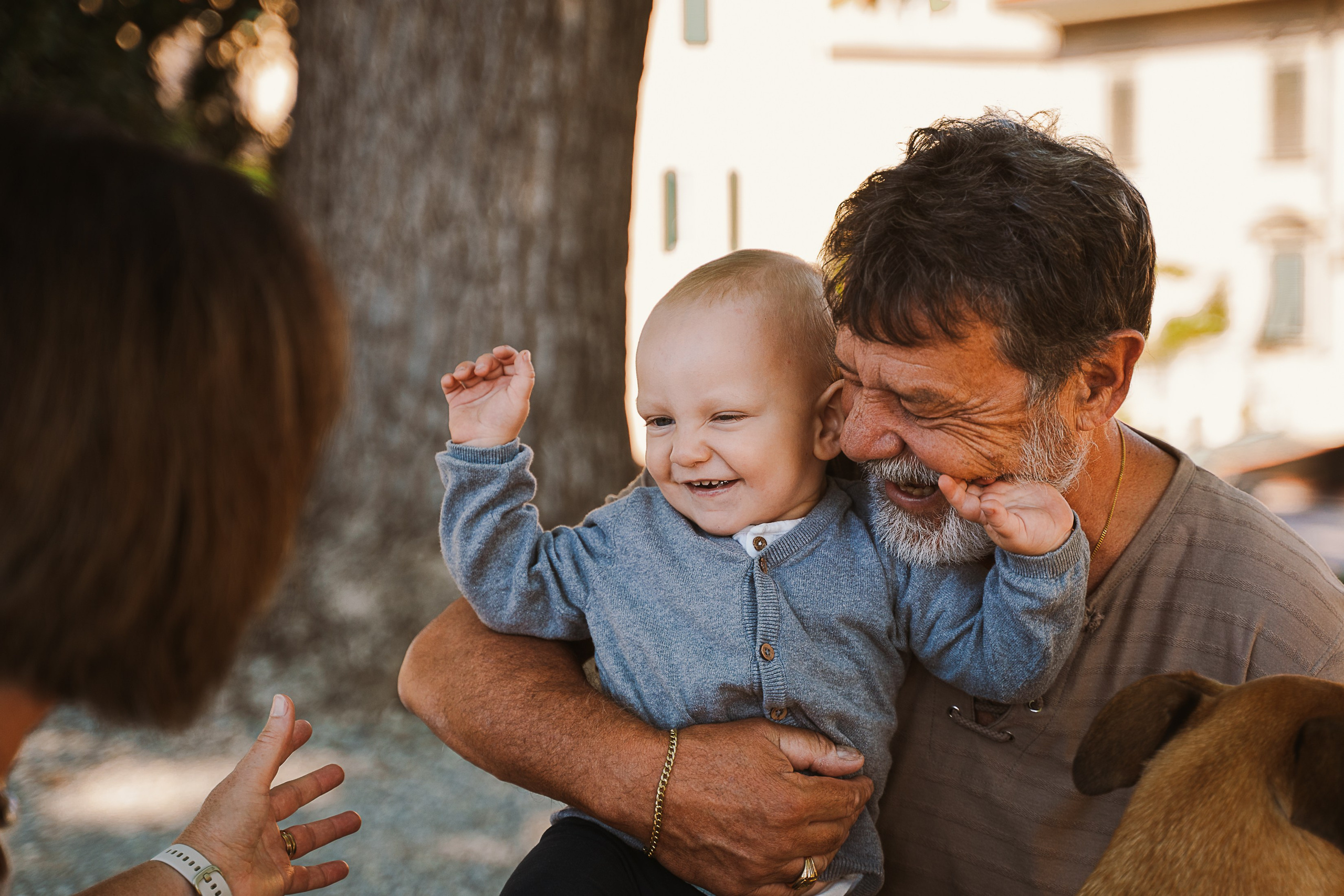 Timeless love: Grannies and grandchildren talking against the beautiful backdrop of Lucca, creating memories to cherish.