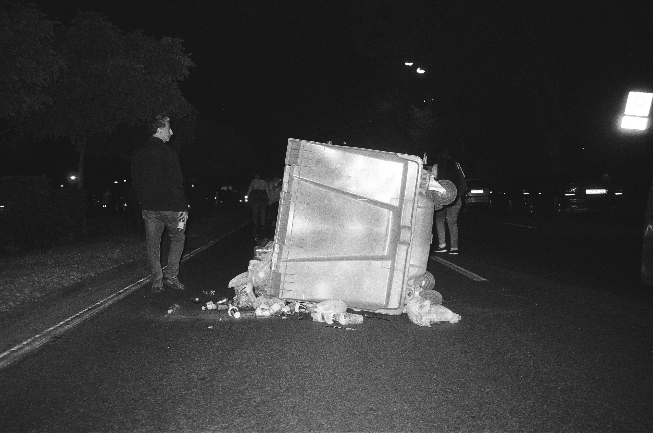 An overturned trash bin, placed by the protesters to block the traffic in the city