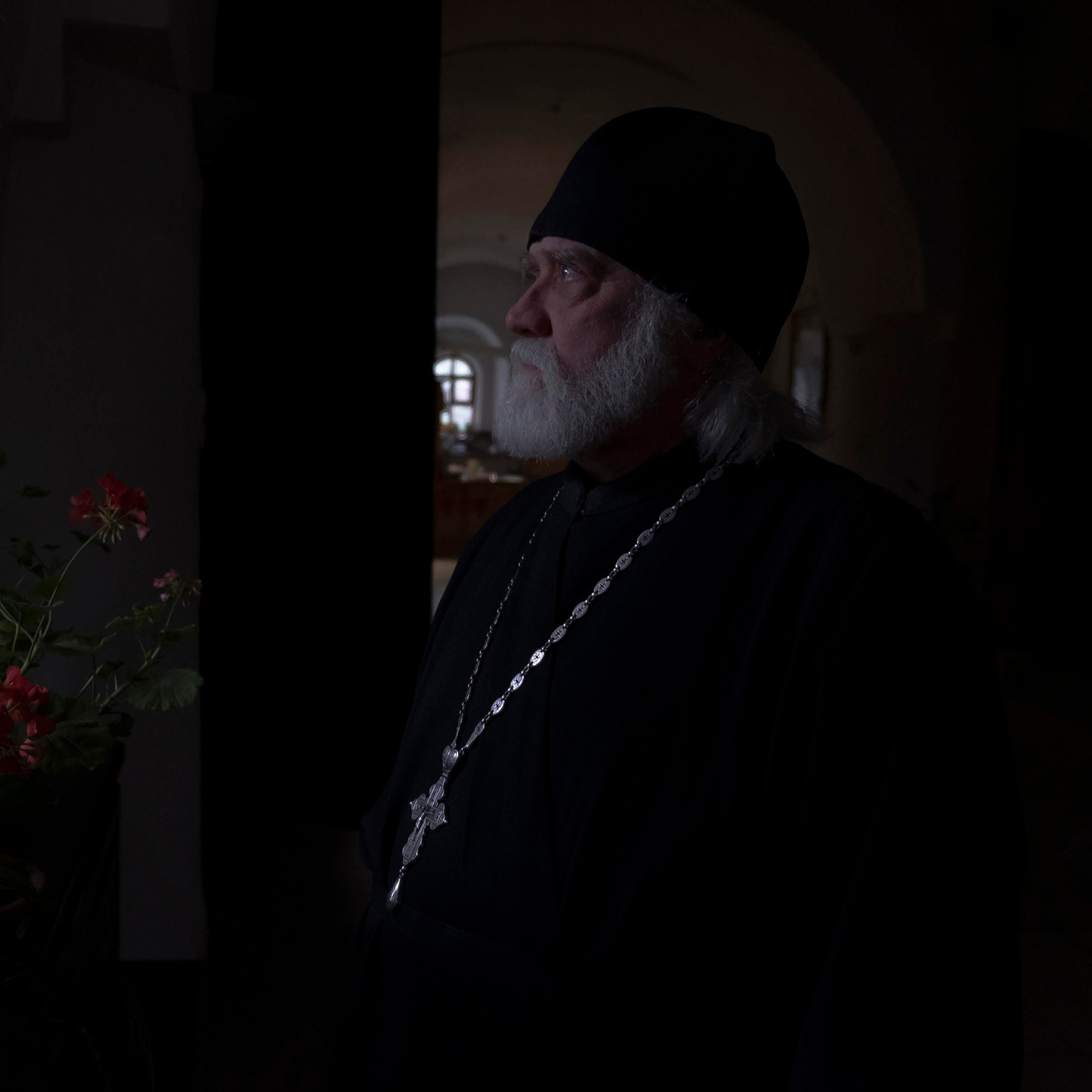 The priest after the funeral service in one of the churches in Pskov, Russia.