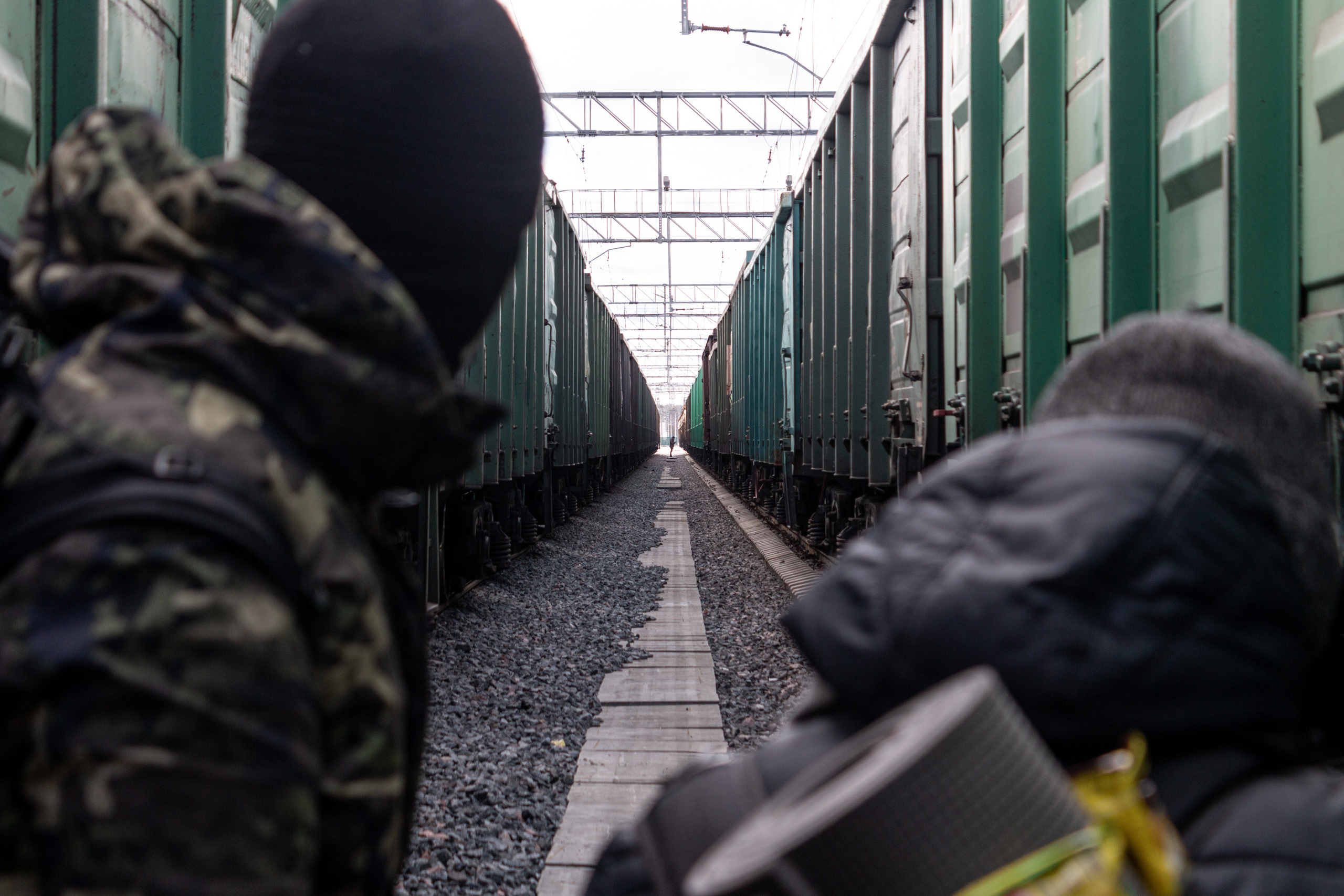 Artem and Maxim noticing an unidentified person between the tracks in the departure yard. If the workers notices they might report about them to the station master and the guys would be detained by the security.