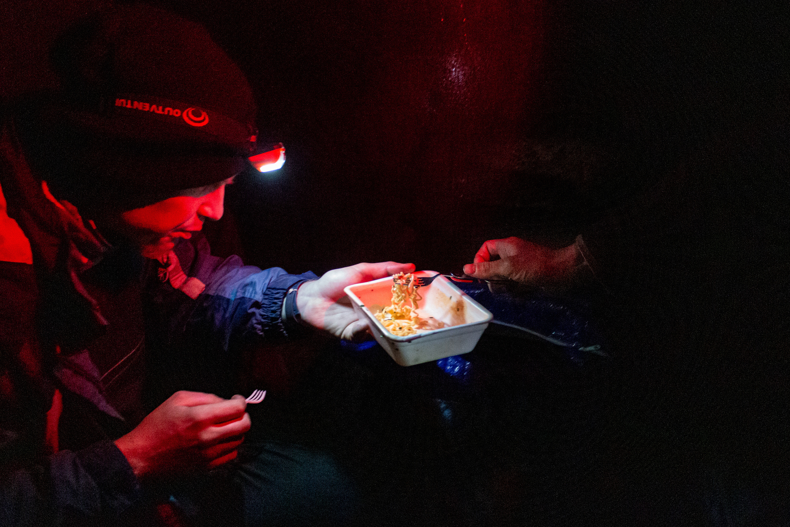 Vanya sharing the food with Vlad. It is very hard to boil the water or heat up the food on the road because of the strong wagon shaking.