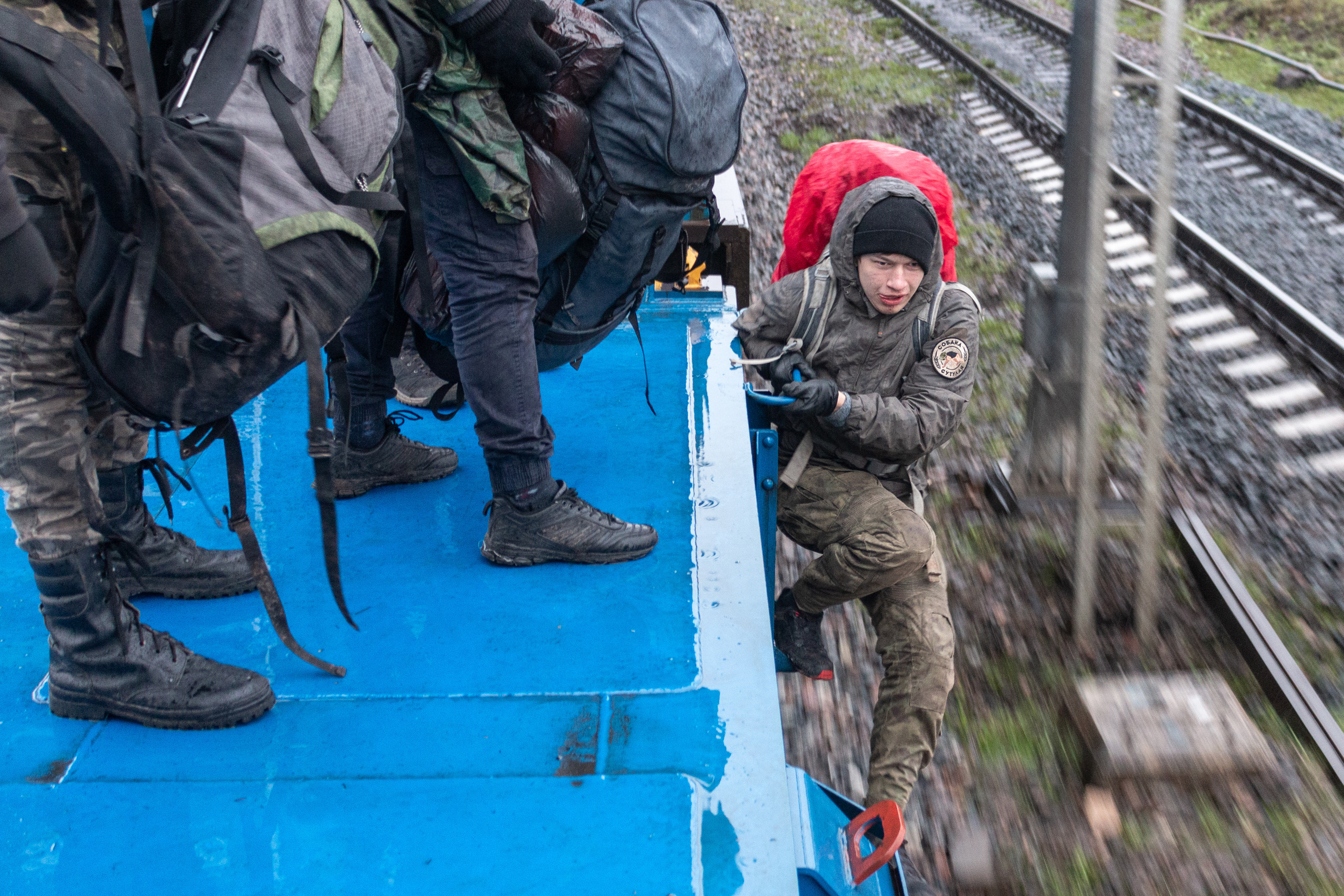 Ilya getting off the moving train platform. To mitigate the risk of getting caught the guys often get off the slowly moving trains just before the station.