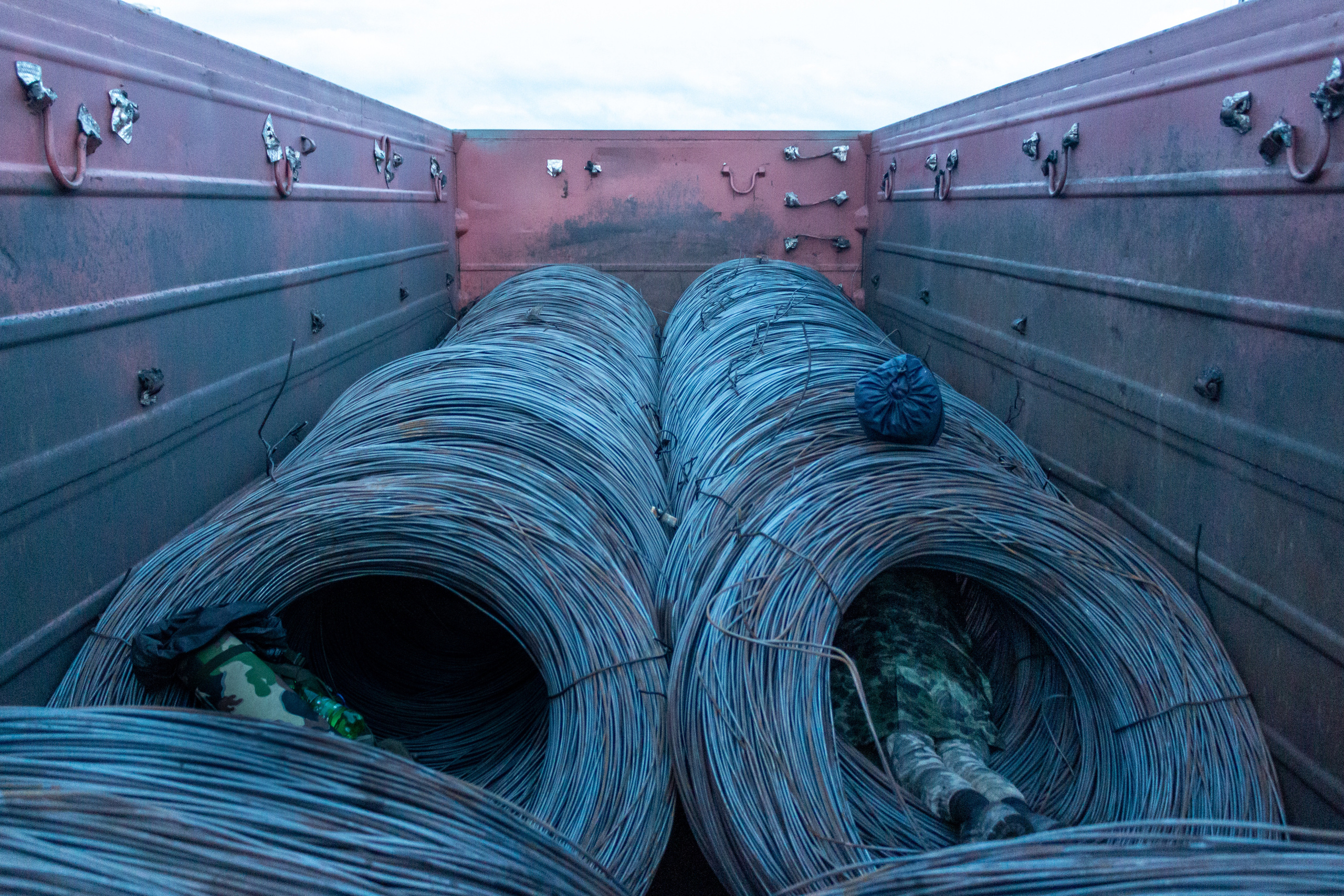 Artem settling for a sleep in the wire tunnel.