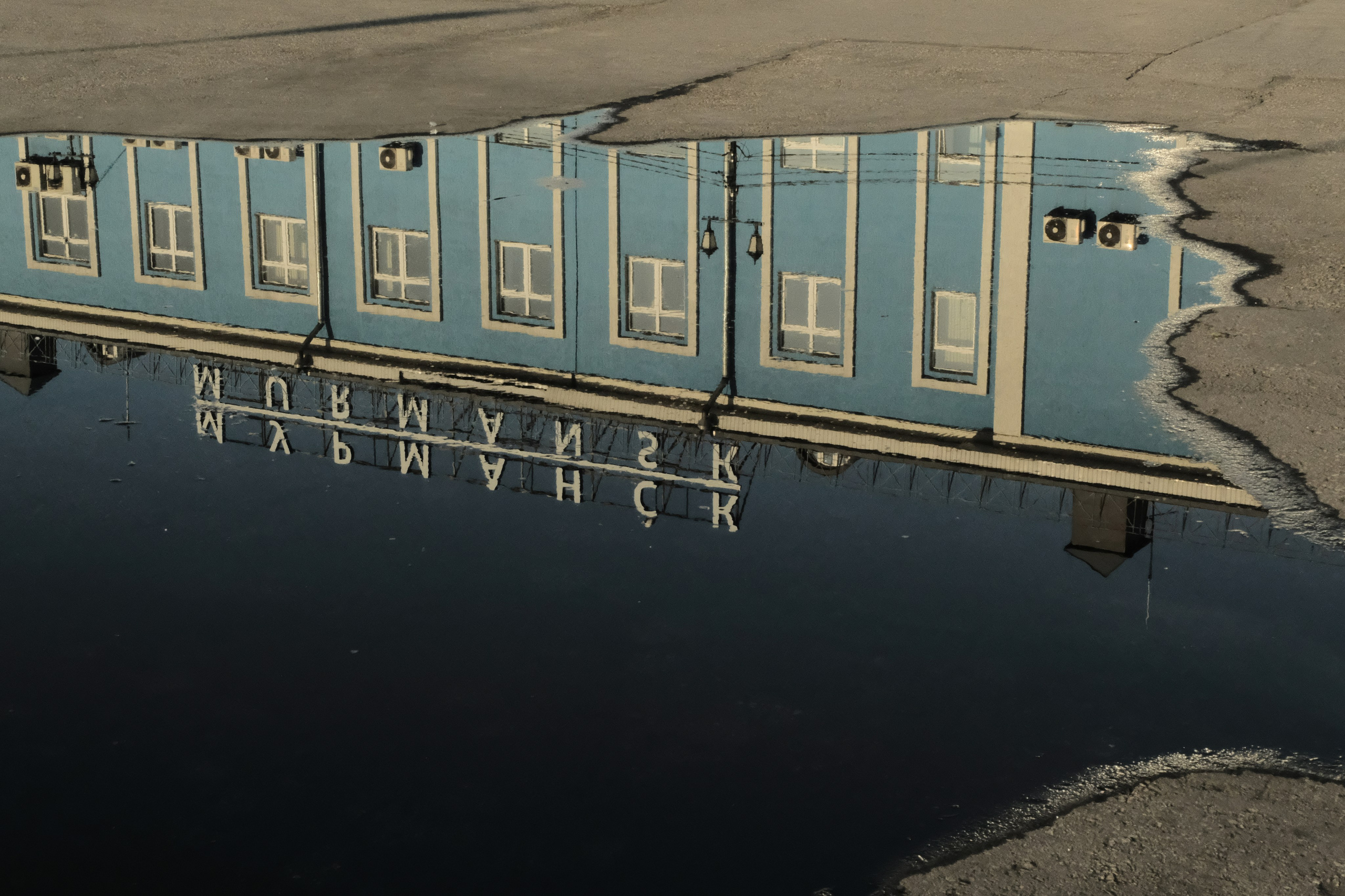 building with a reflection of it