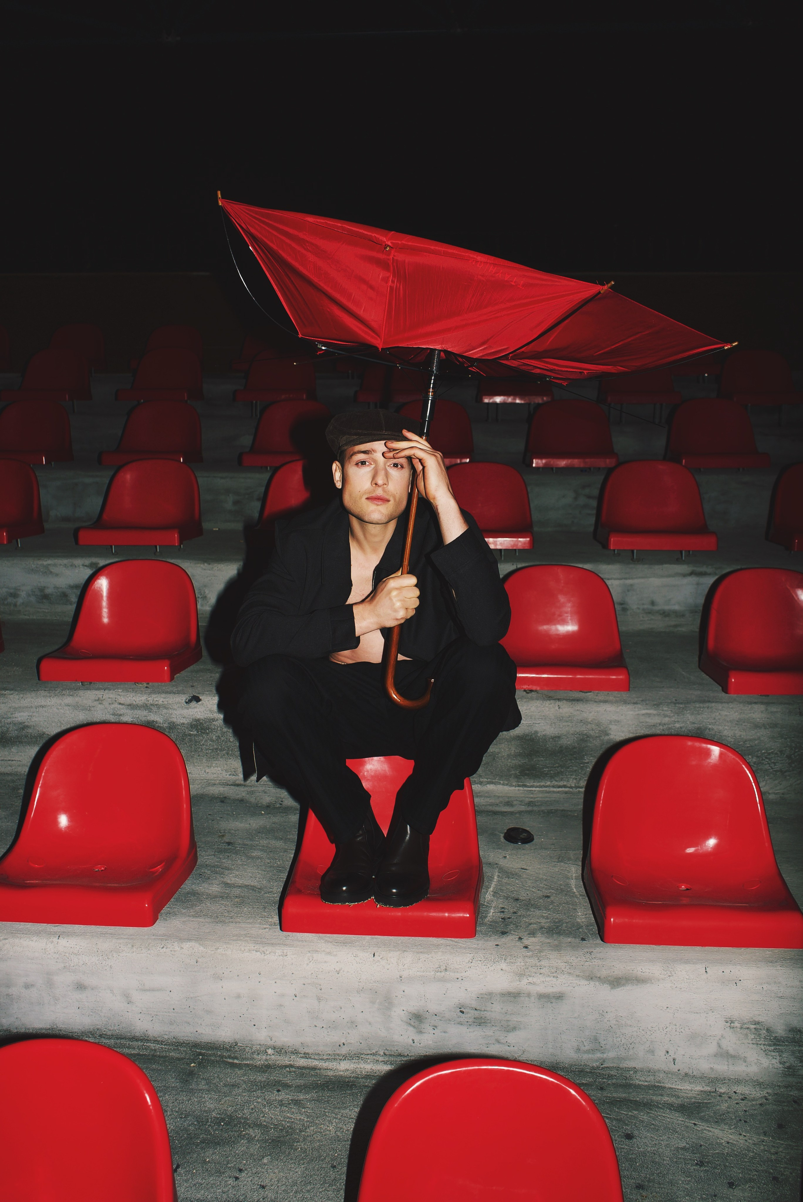Editorial fashion portrait with red cinematic lighting and dramatic atmosphere in Istanbul